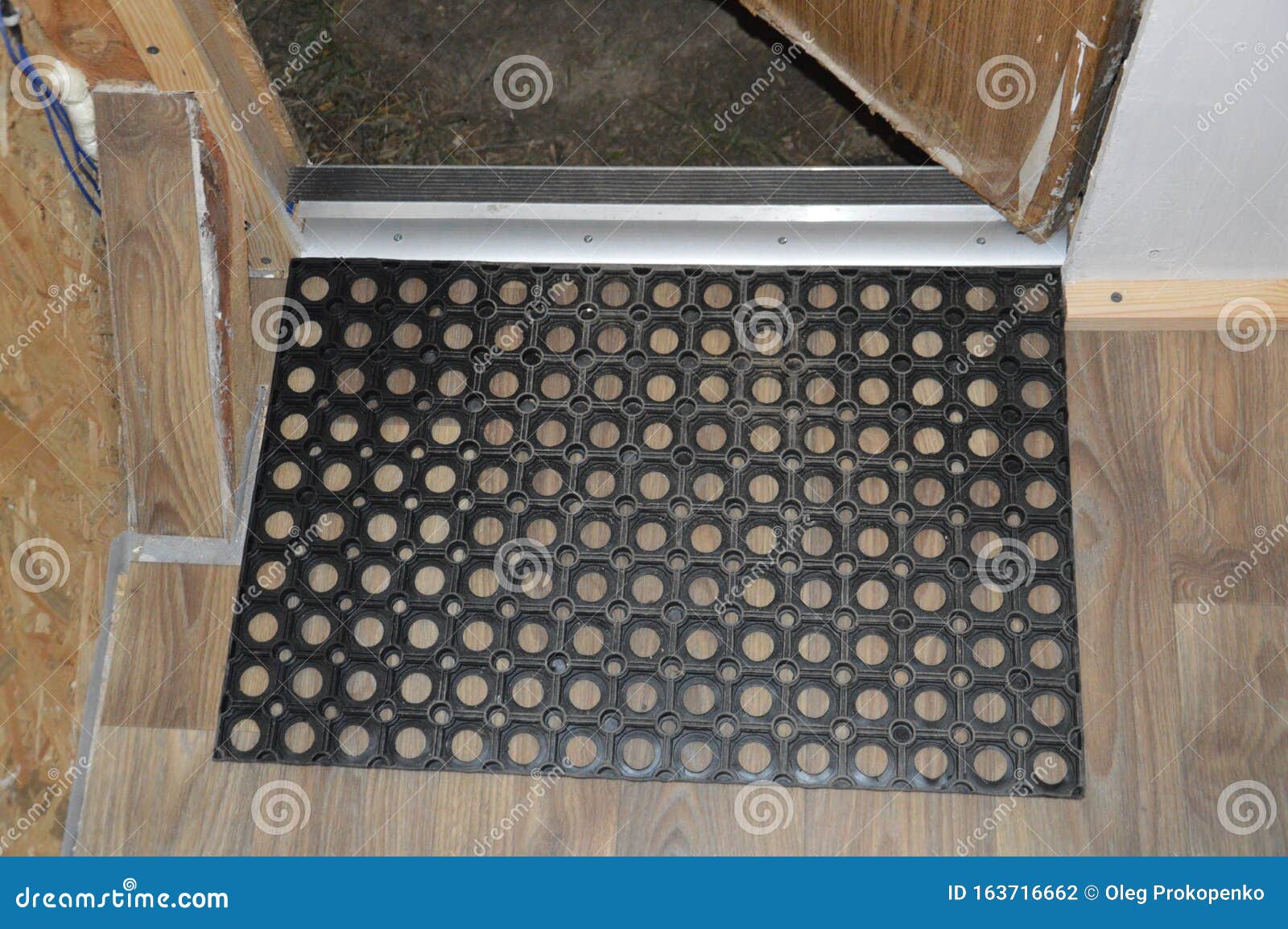 Installation of Floor Skirting Boards on the Floor and Linoleum Stock
