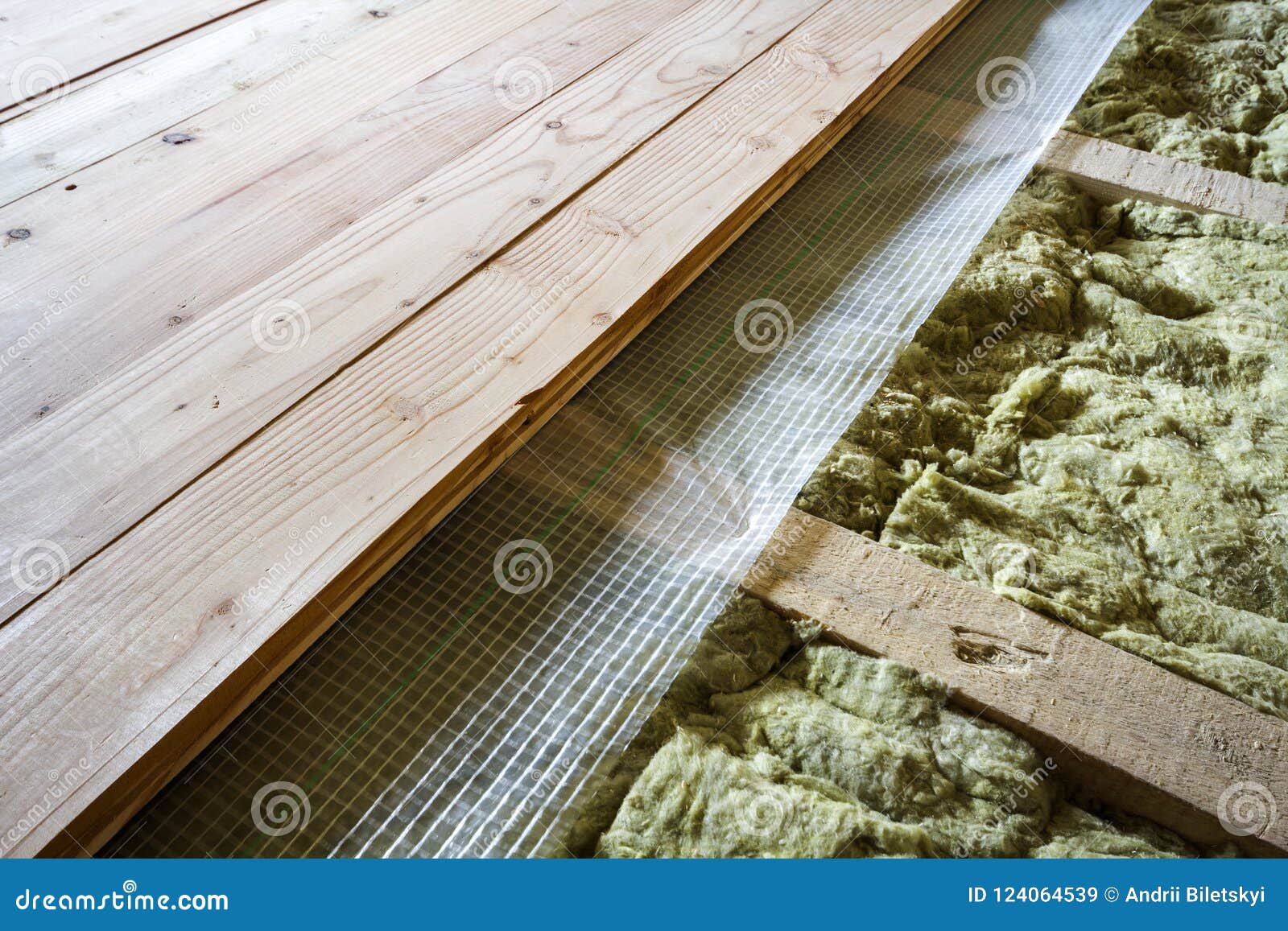 installation of new floor of wooden natural planks and mineral wool insulation for isolation and keeping warmth. modern technologi