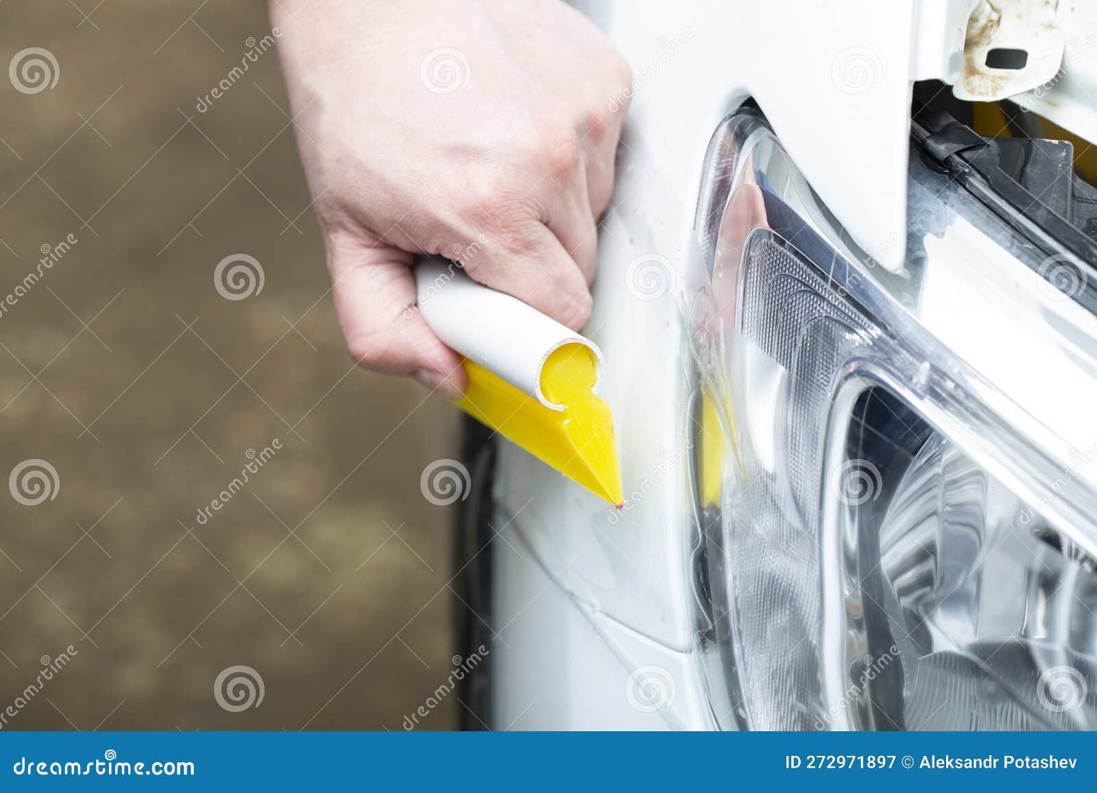 Installation of a Protective Film for Car Paint.the Workers Install a