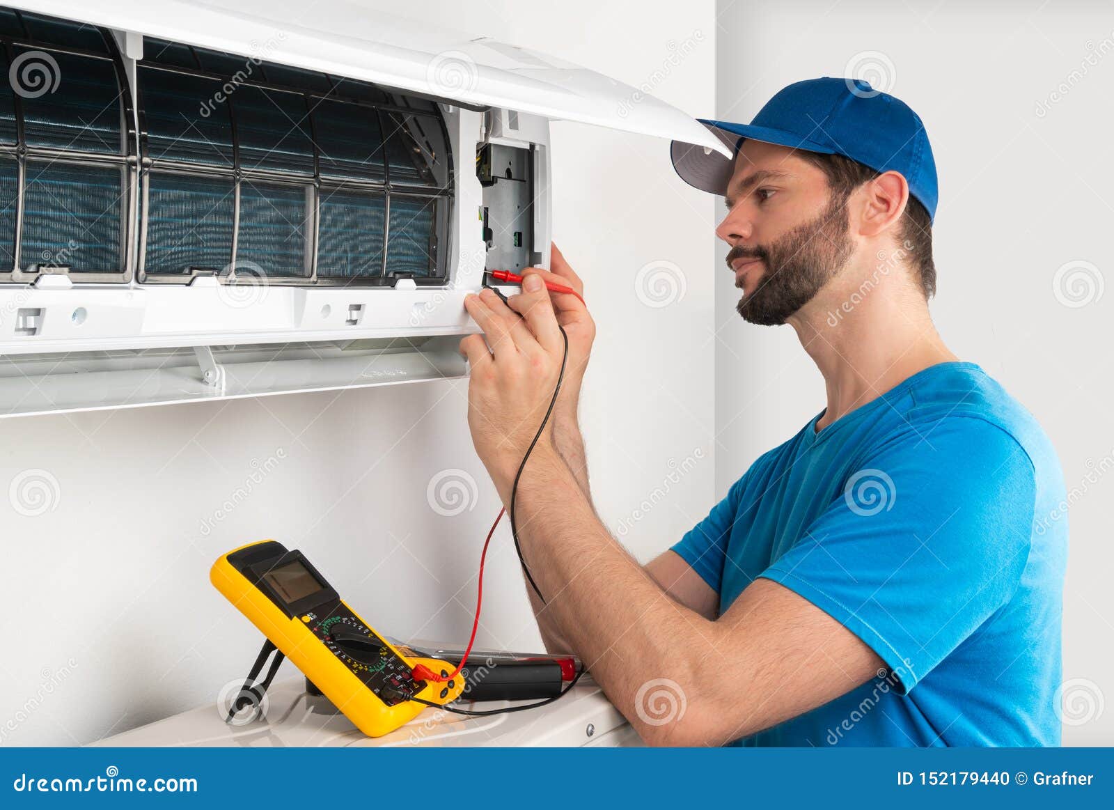 Technican Engineer Doing Air Conditioner Maintenance Stock Photo