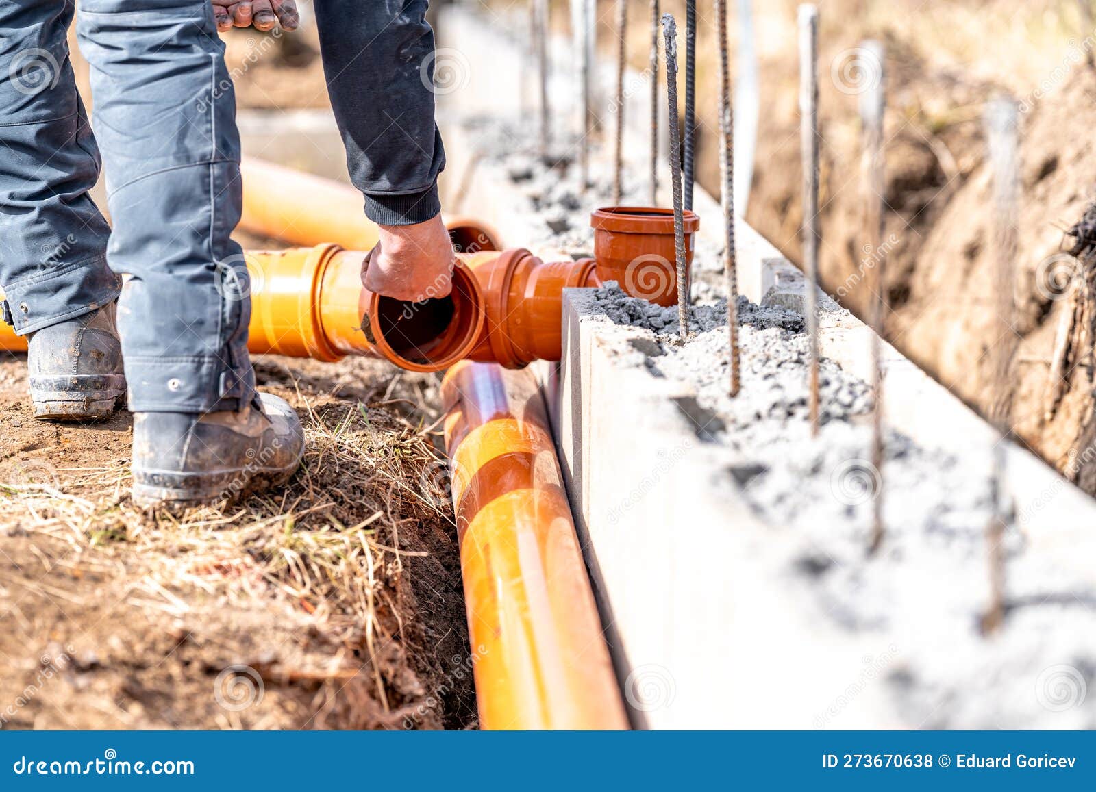 Installation of a Sewage Plastic Pipe during the Construction of a