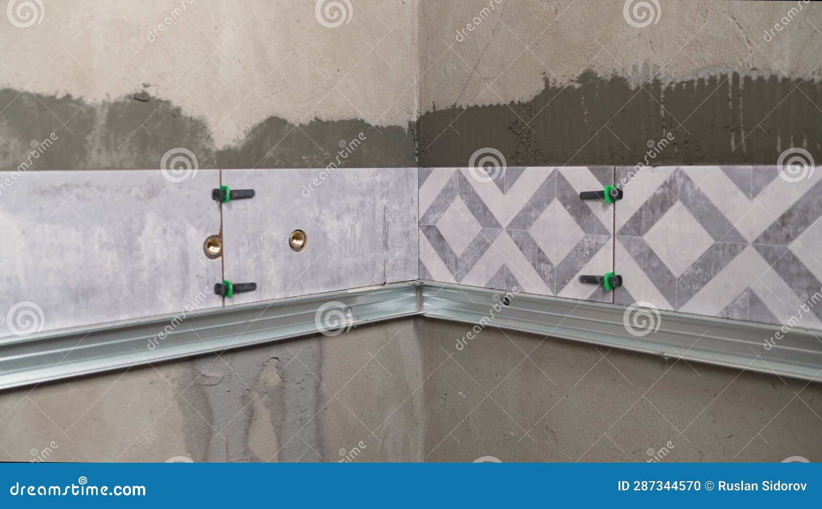 Installation Wall Tile. Worker Laying Tiles on the Wall. . Ceramic