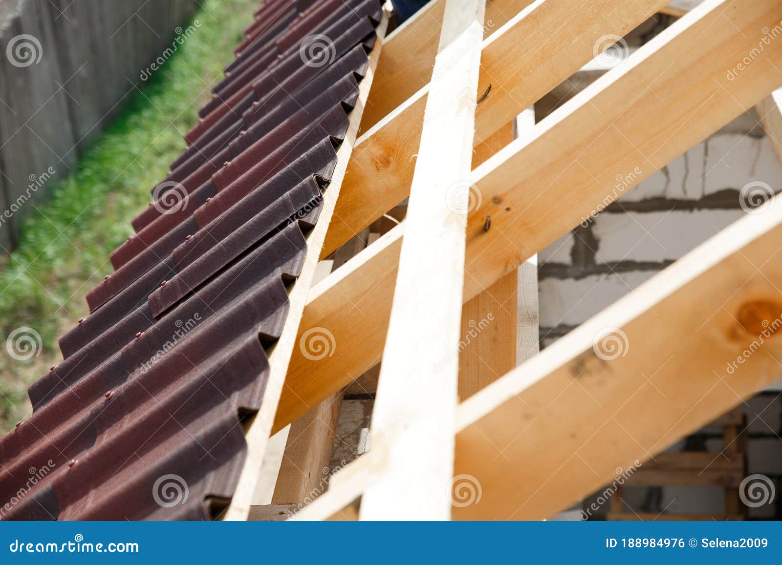 installation of a wooden roof and closing the roof with onduvilla bituminous tiles. woods s and components of the