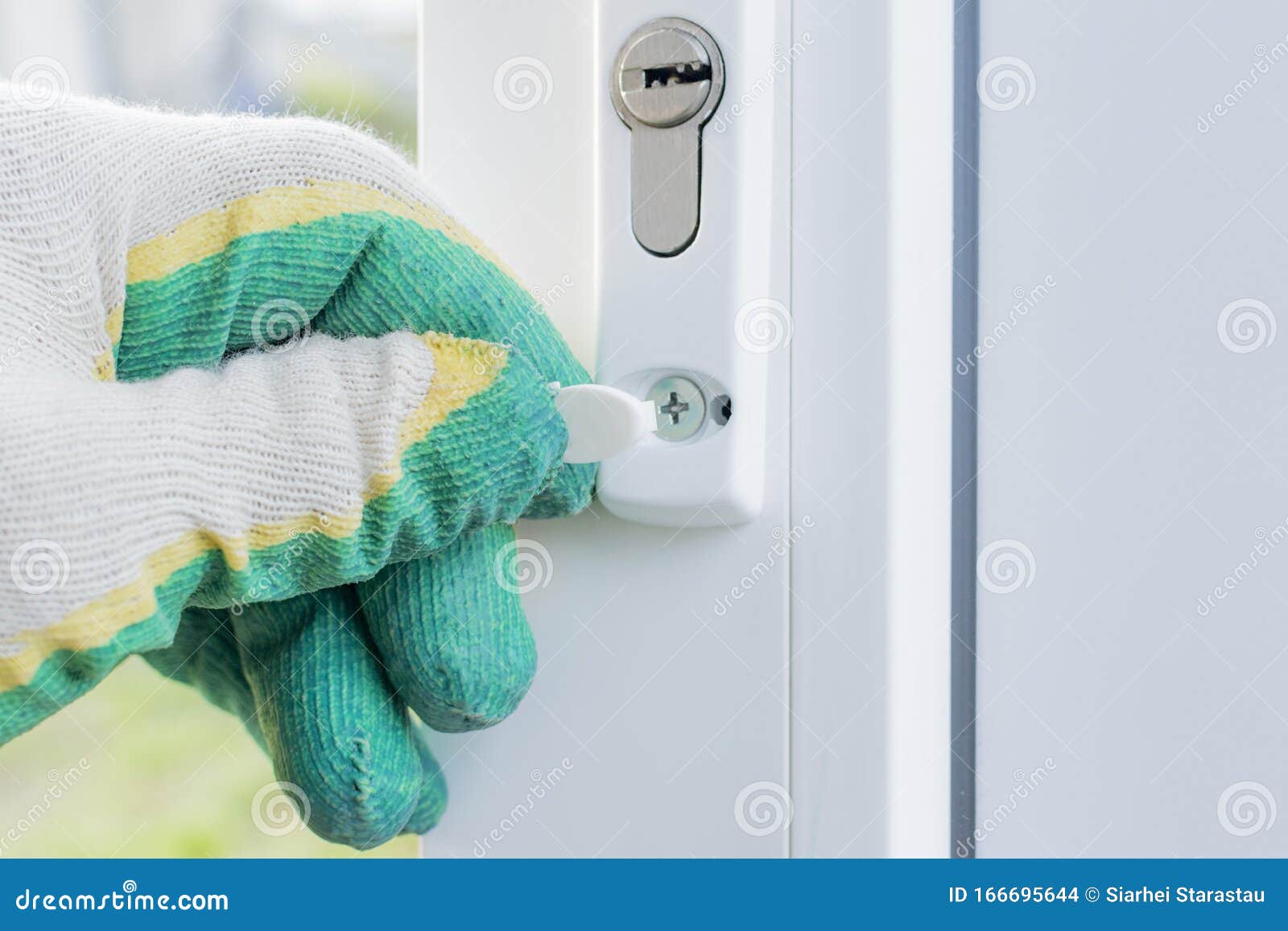 The Installer Installs and Adjusts the Plastic Door Stock Photo Image