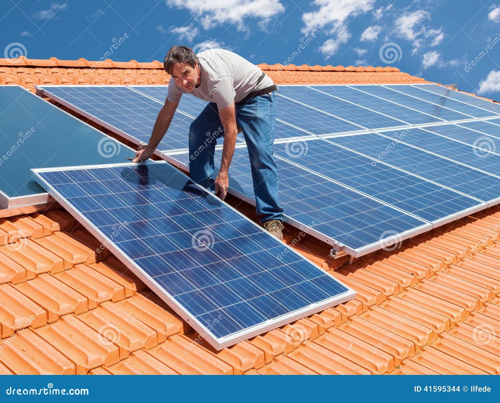 Installing Alternative Energy Photovoltaic Solar Panels Stock Photo