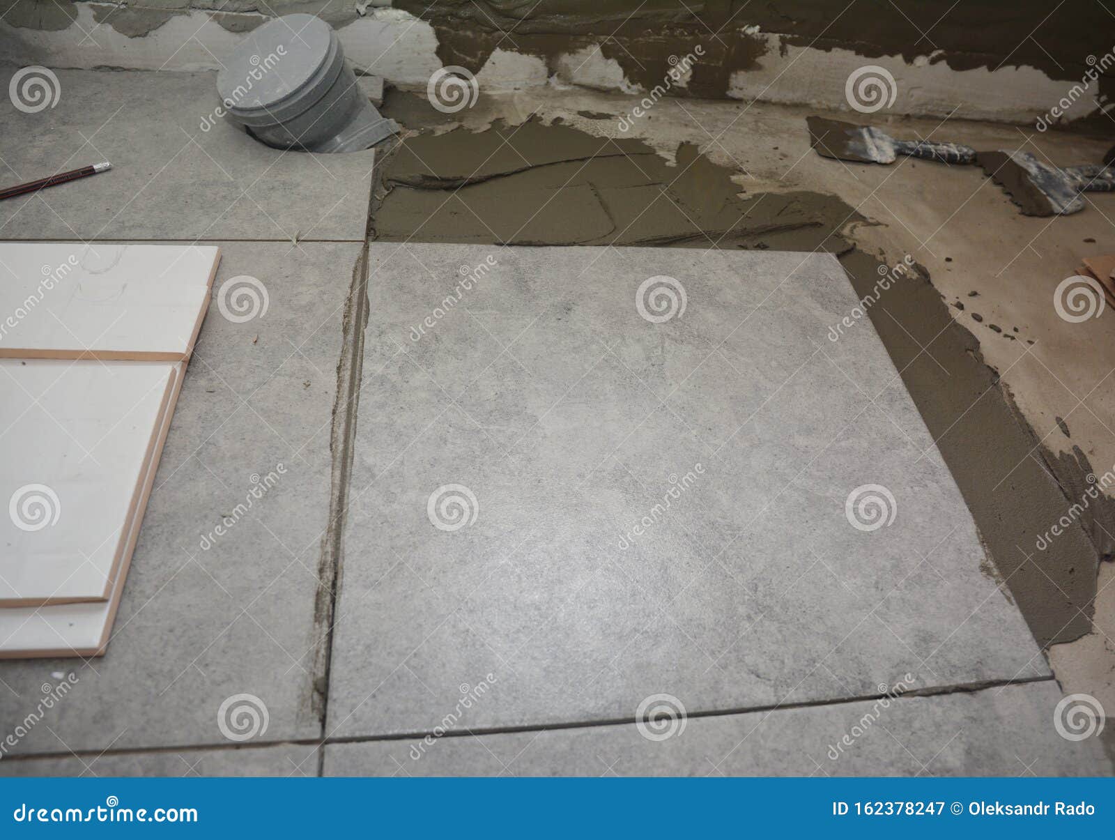 Installing Ceramic Tile on the Floor, Bathroom Flooring Stock Image