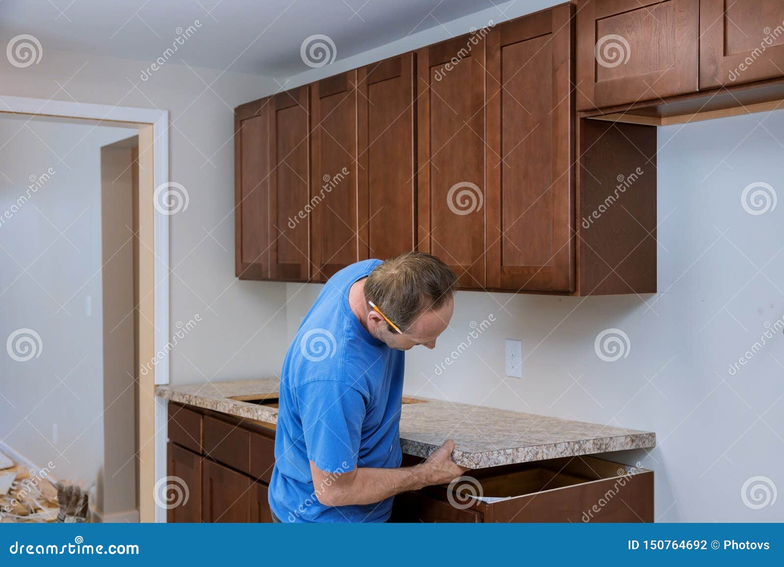 Installing Contractors A Laminate Counter Top A Kitchen Remodel Stock Photo Image Of Countertops