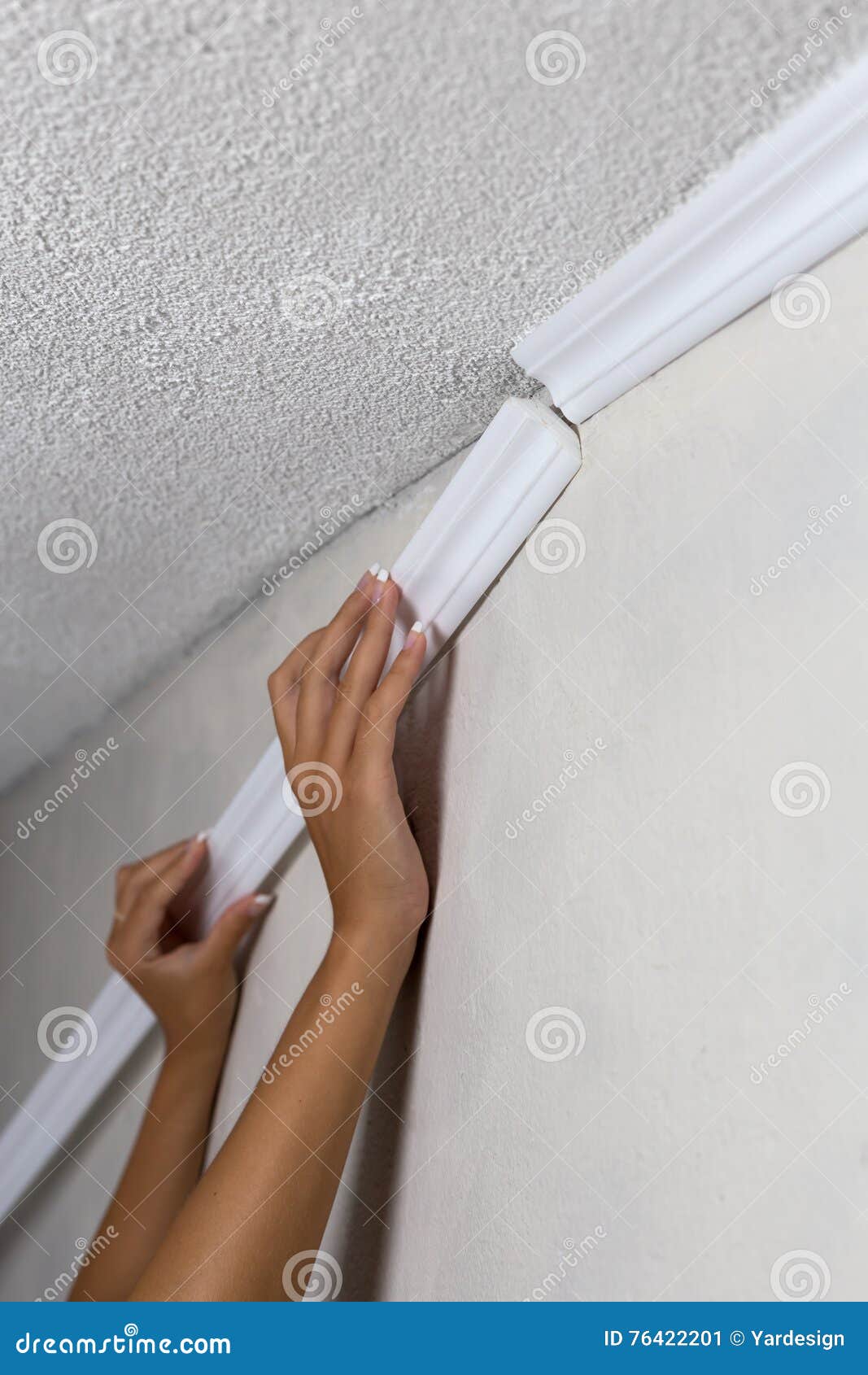 Installing Crown Molding On Ceiling In Room With Painted