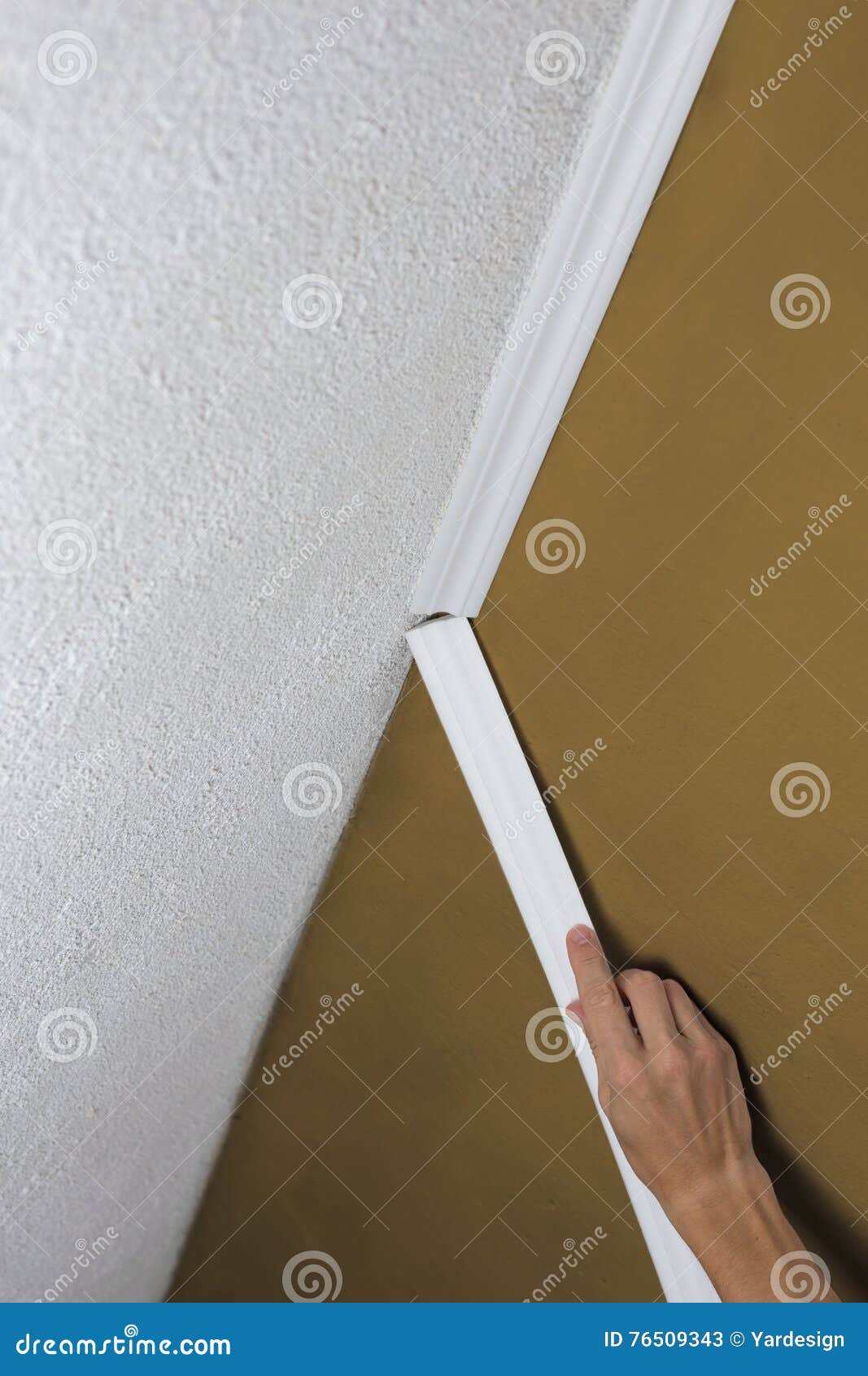 Installing Crown Molding On Ceiling In Room With Painted