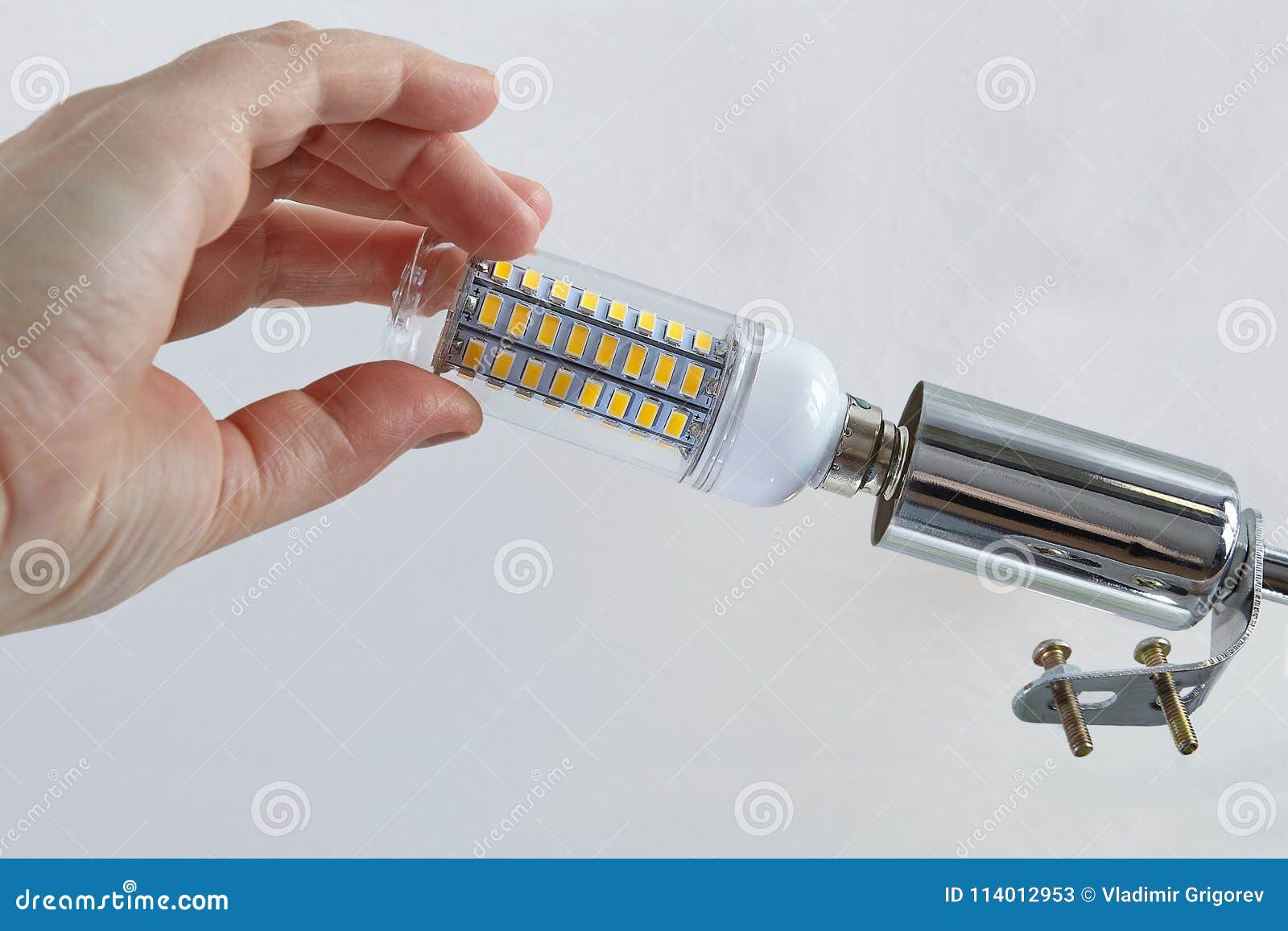 Installing An Energy Efficient Led Lamp In Ceiling Light Stock