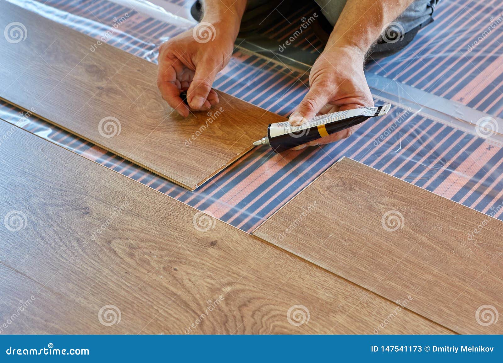 Laying Laminate Covering On Heat Insulated Floor Stock Image