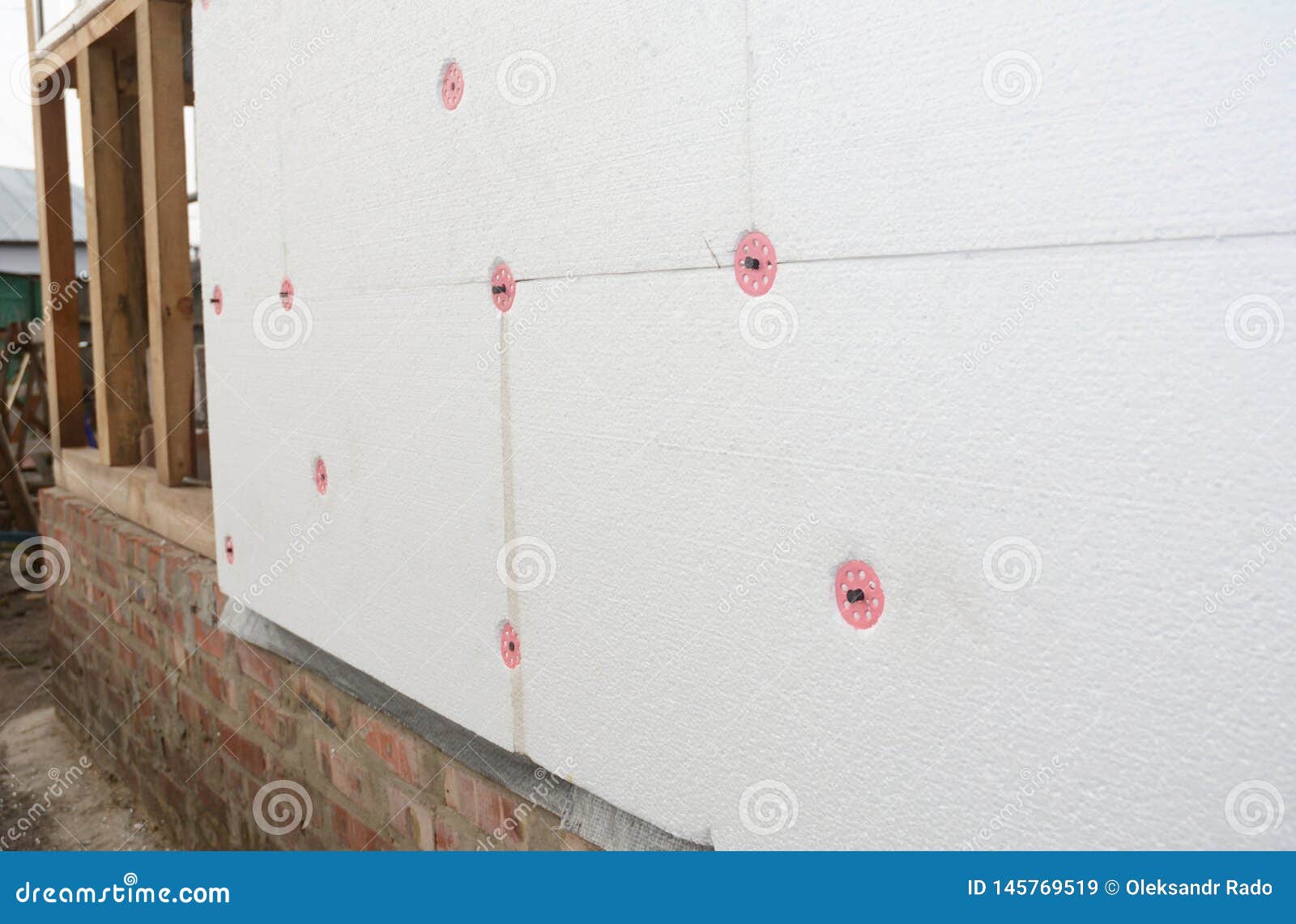 Installing Foam Insulation Board with Plastic Nails for House Energy