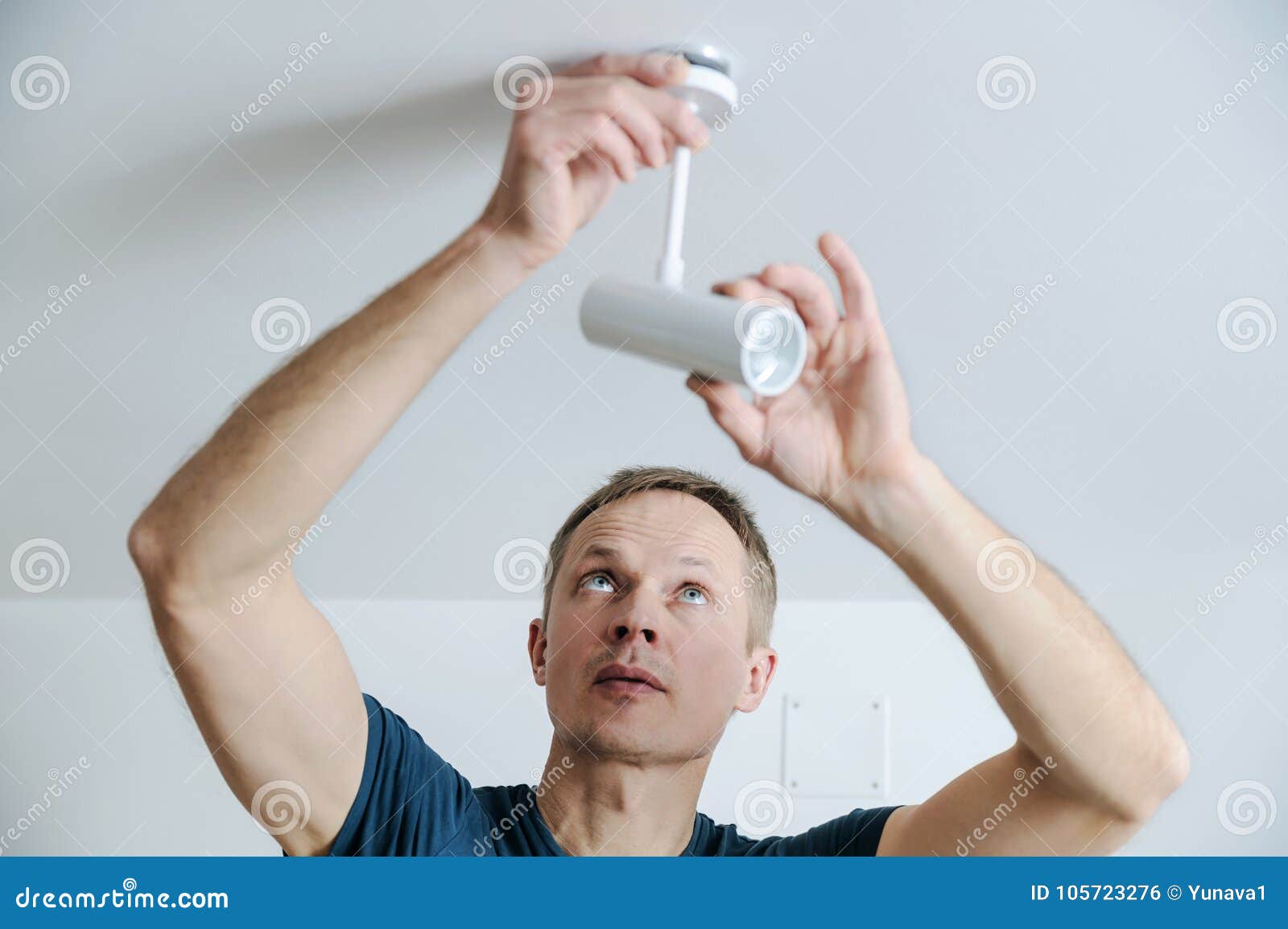 Installing a lamp at home. stock photo. Image of electric 105723276