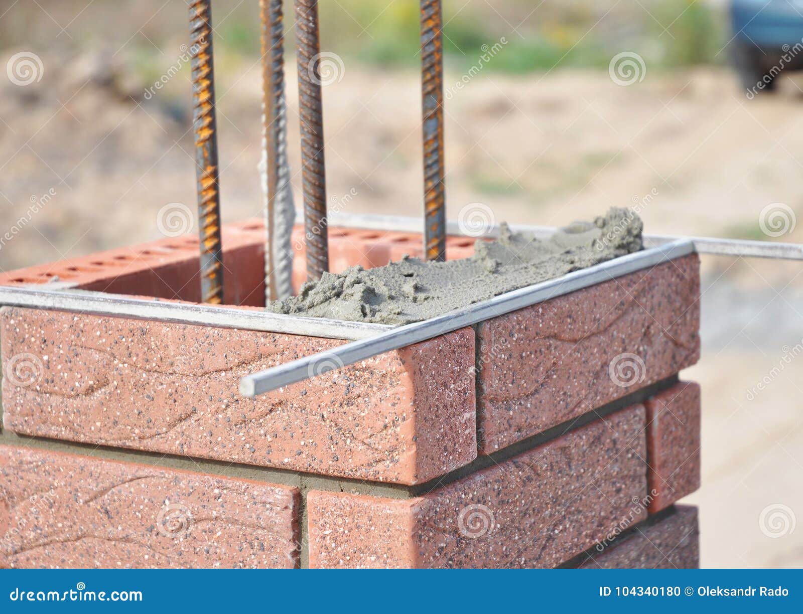 Installing Red Clinker Blocks and Caulking Brick Masonry Joints