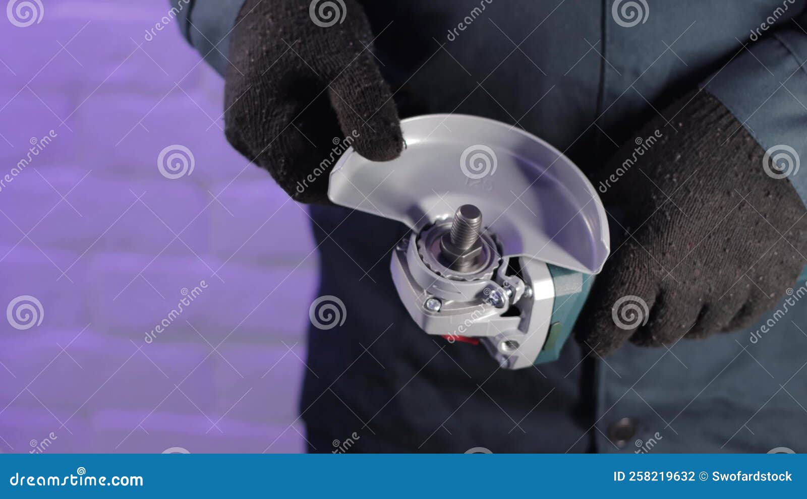 Installing the Safety Cover on an Angle Grinder, Closeup. Safety Precautions when Working with