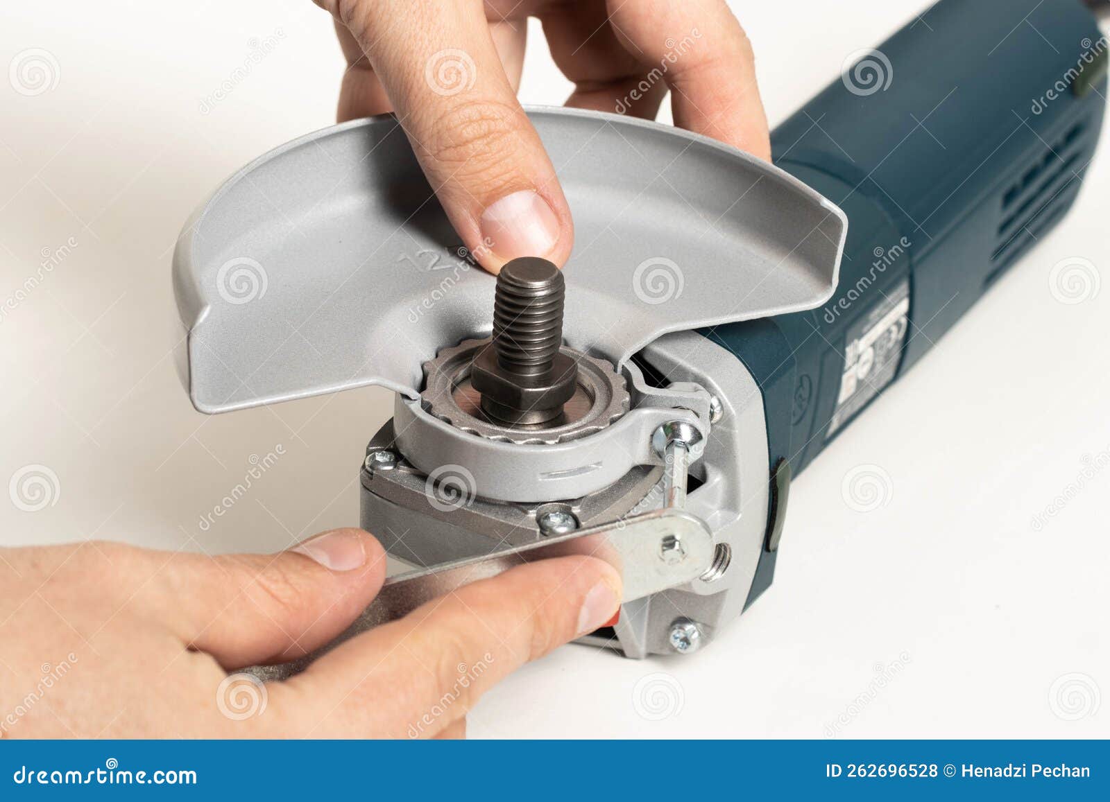 Installing the Safety Cover on an Angle Grinder, Closeup. Safety Precautions when Working with