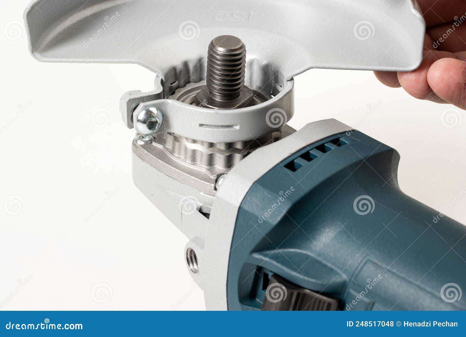 Installing the Safety Cover on an Angle Grinder, Closeup. Safety Precautions when Working with