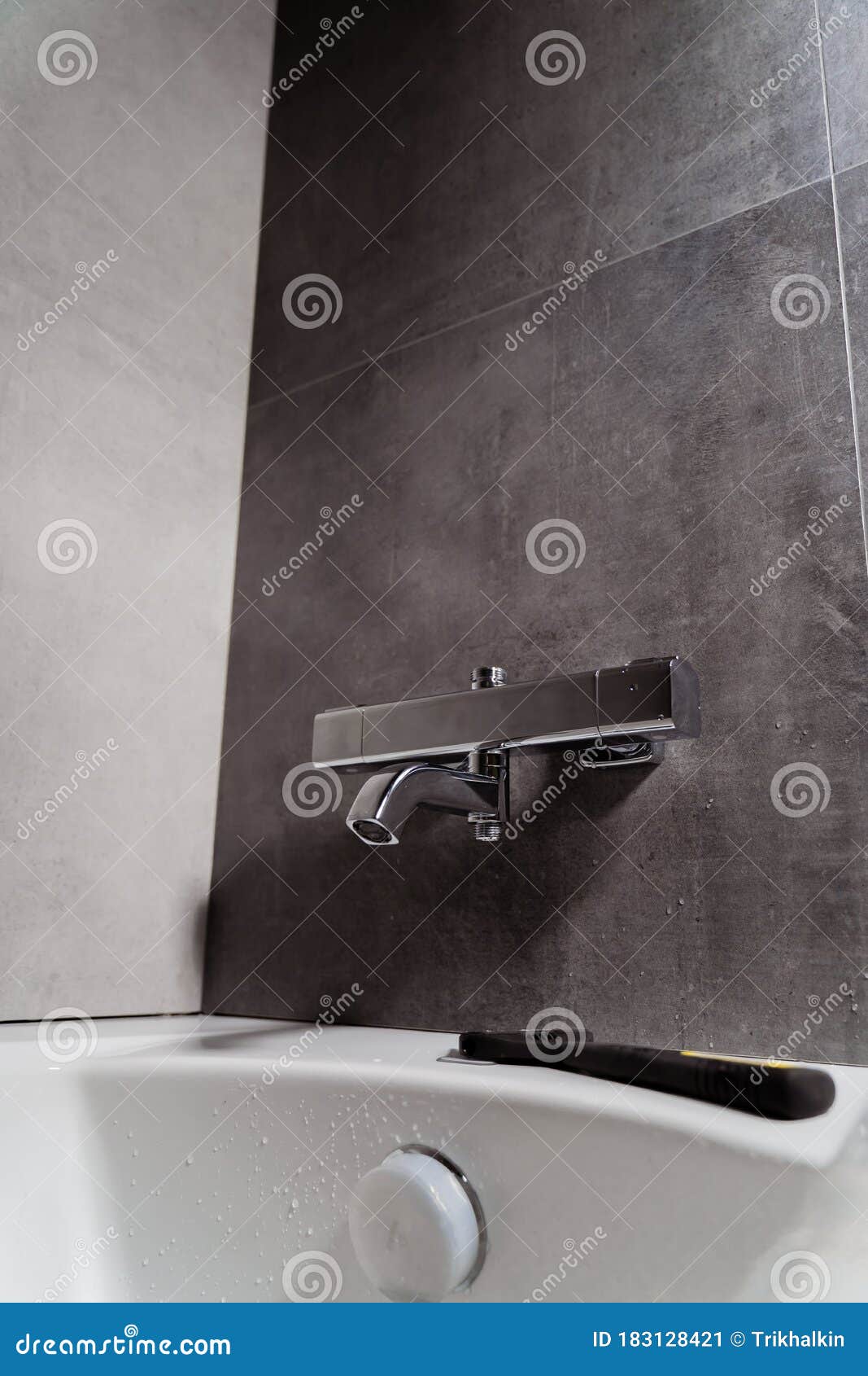 Installing a Shower Faucet in the Bathroom. an Adjustable Spanner Lies