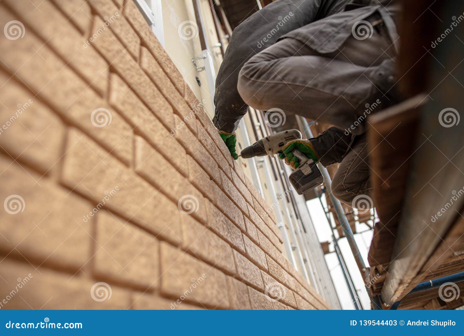 Installation of Plastic Siding Under the Brick Stock Image Image of