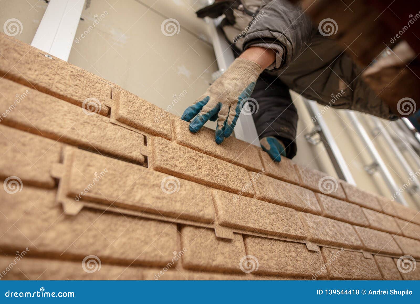 Installation of Plastic Siding Under the Brick Stock Photo Image of