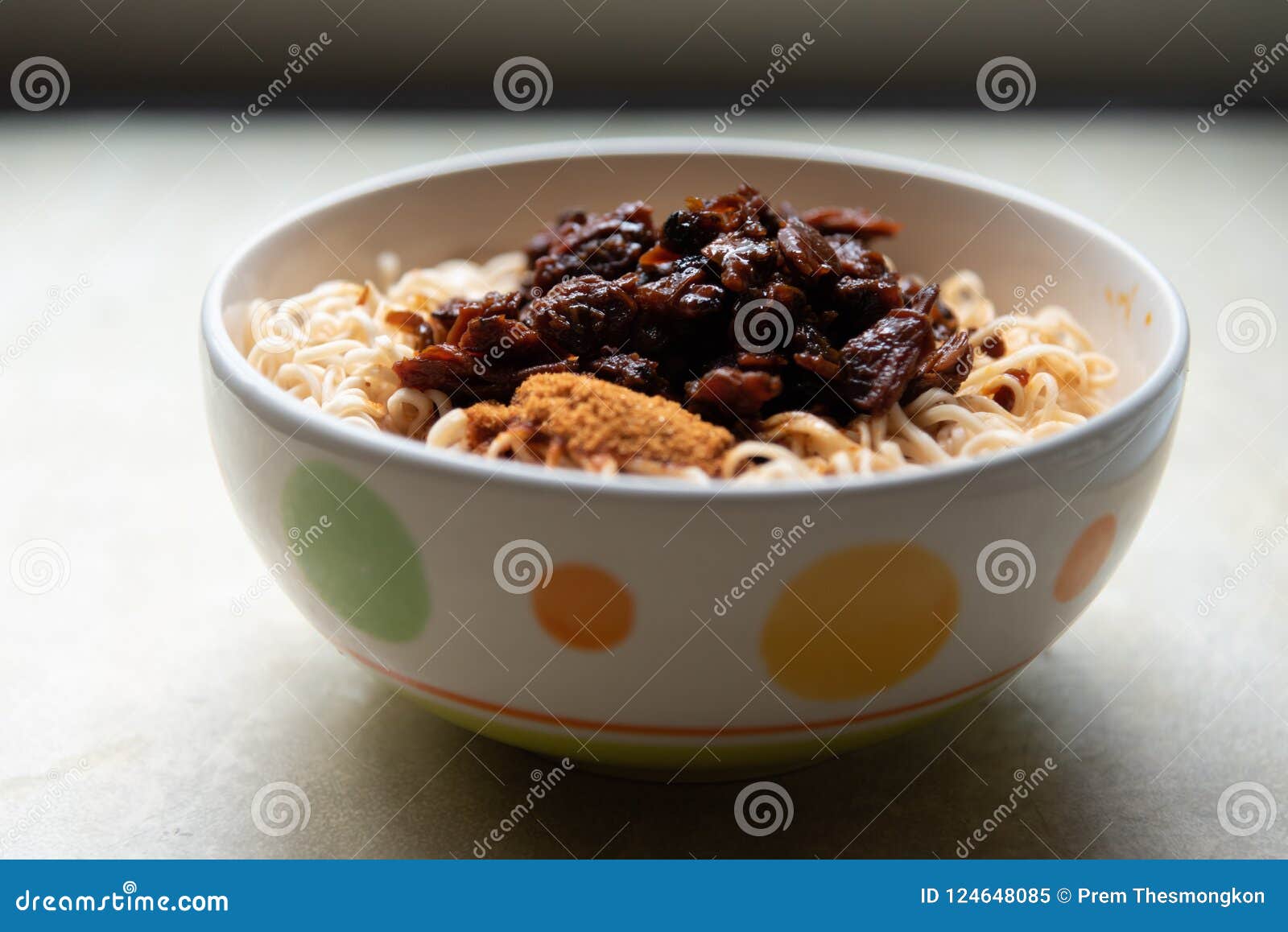 Instant Noodle in Colorful Ceramic Bowl and Seasoning Stock Image