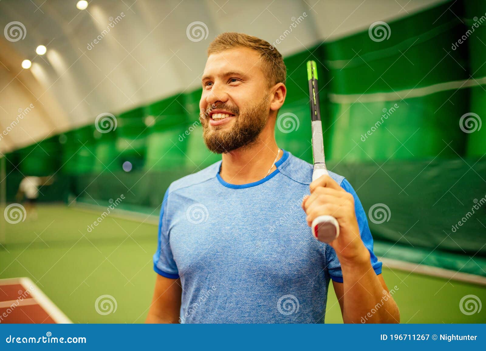Instructor or Coach Teaching How To Play Tennis on a Court Indoor Stock ...