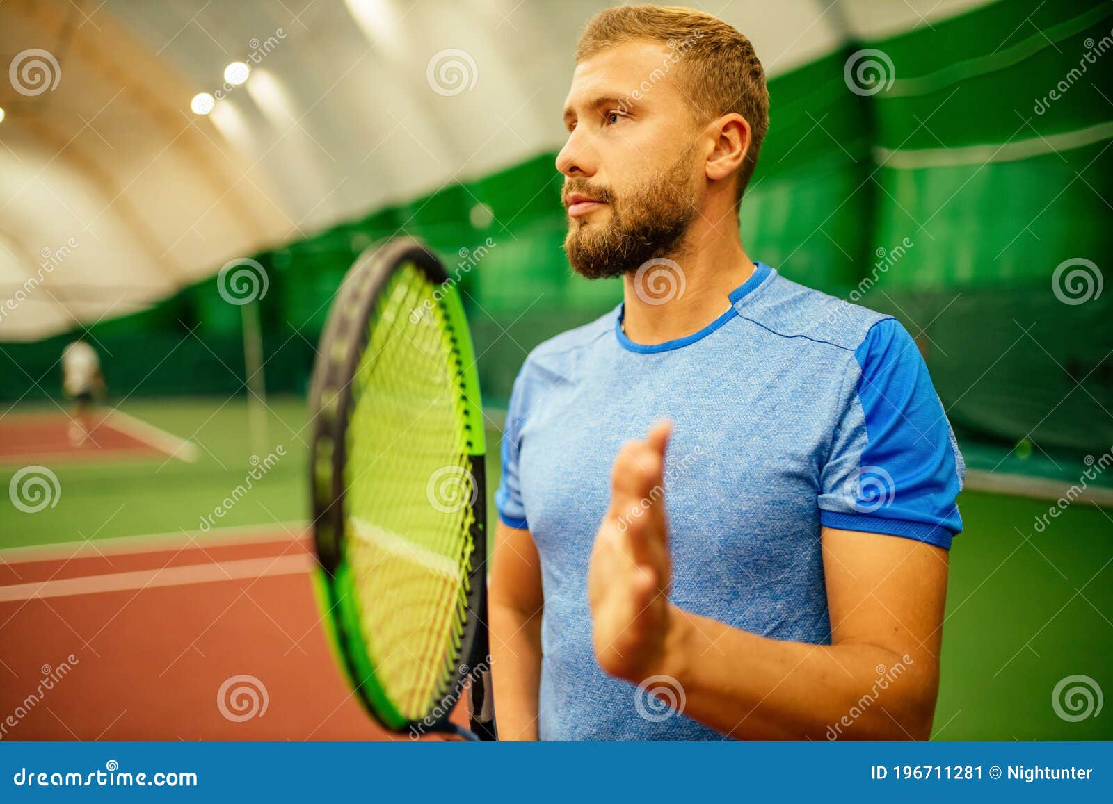 Instructor or Coach Teaching How To Play Tennis on a Court Indoor Stock ...