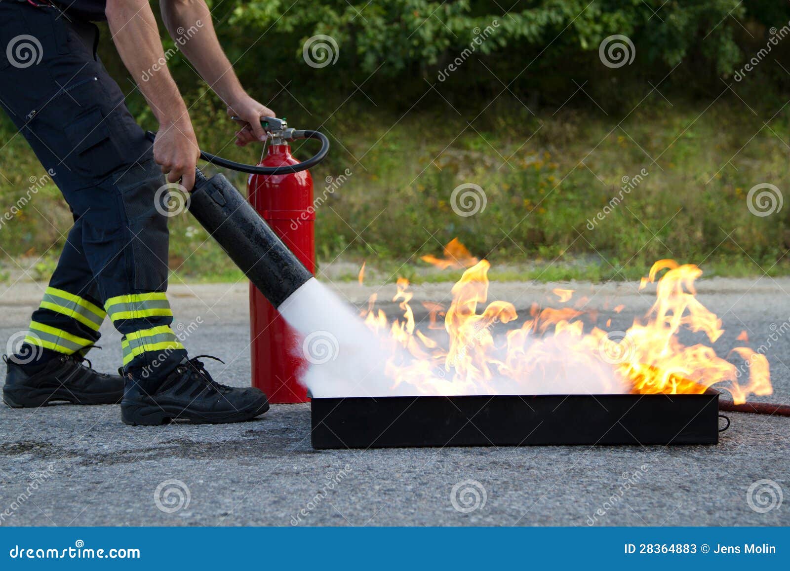 instructor showing fire extinguisher
