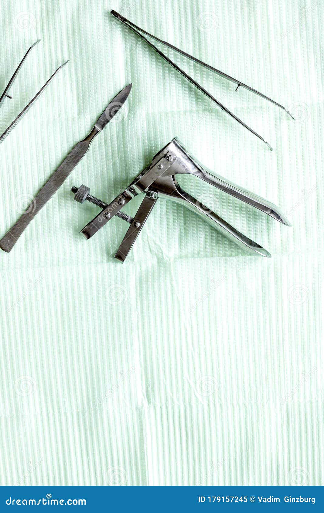 Instruments of Gynecologist on Green Background Top View Mock Up Stock