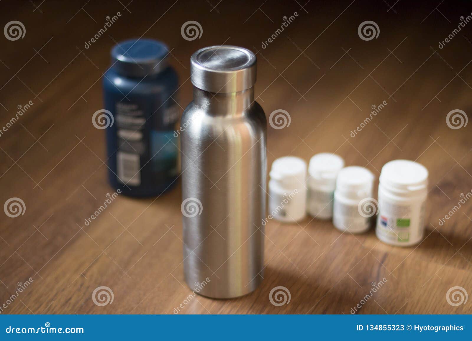 Insulated Stainless Bottle Next To Pill Bottles Stock Image Image of