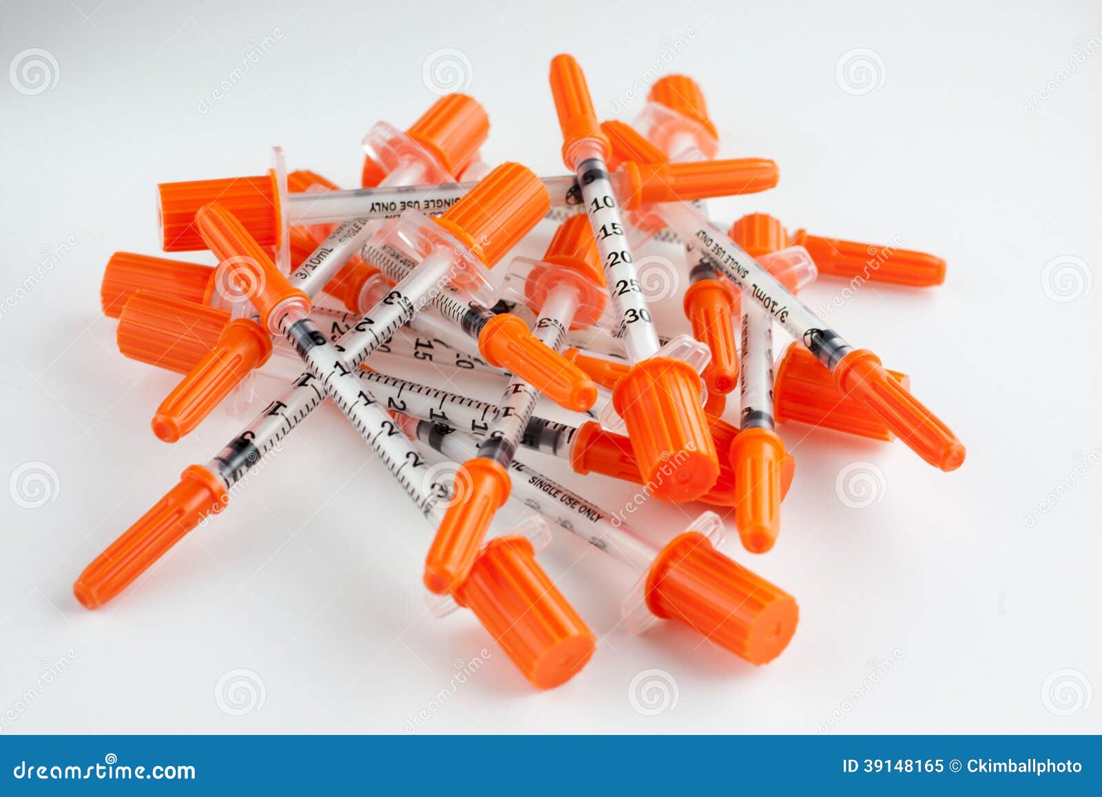 Close Up Shot Of A Pile Of Medical Insulin Needles With Orange