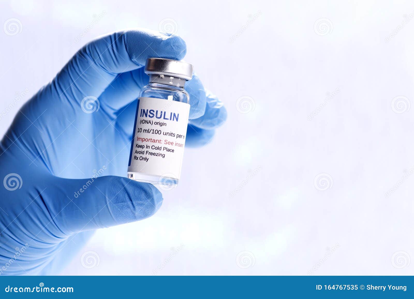 insulin vial in hand