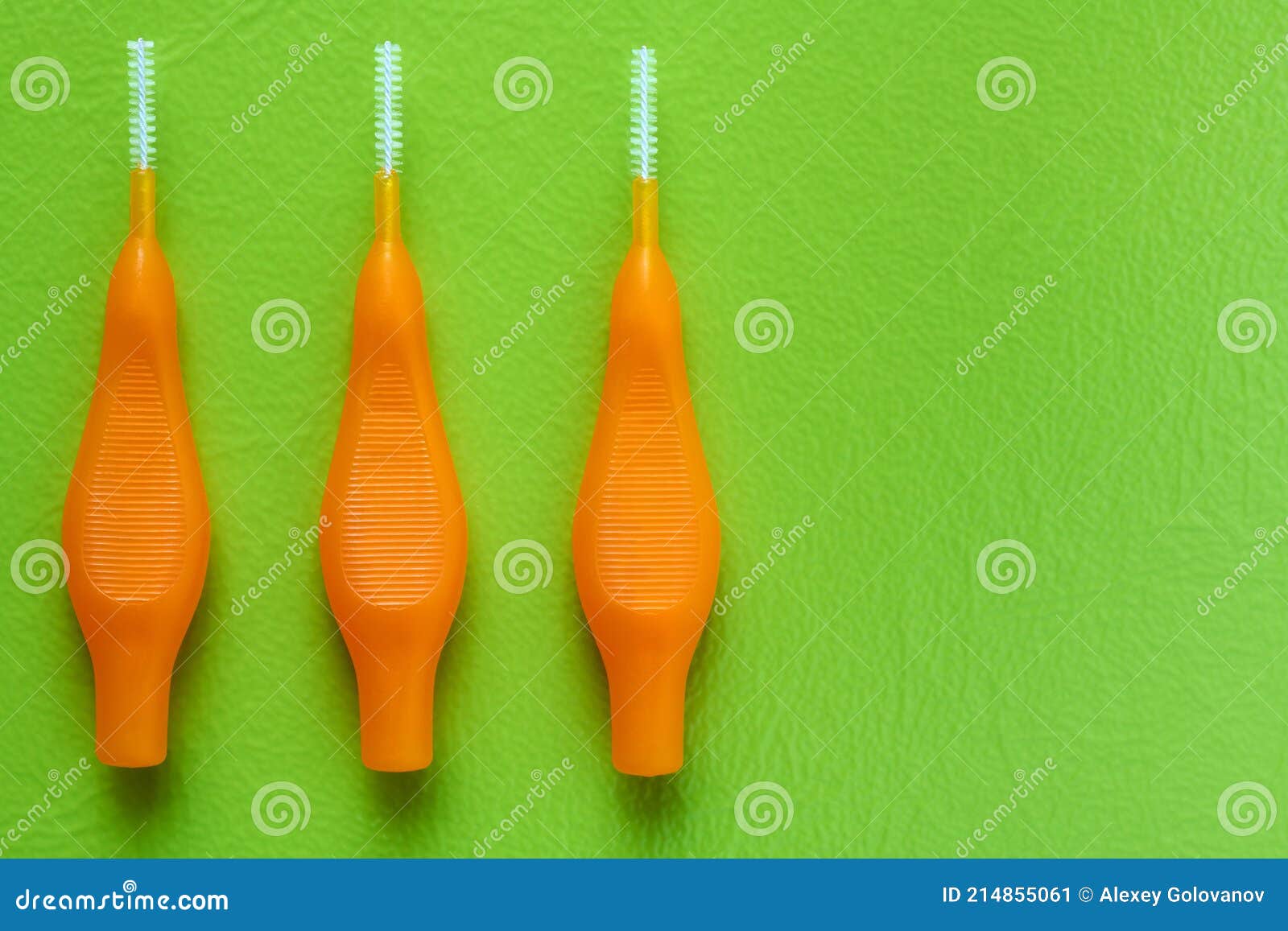 Interdental Brush for Interdental Spaces on Green Background with Copy