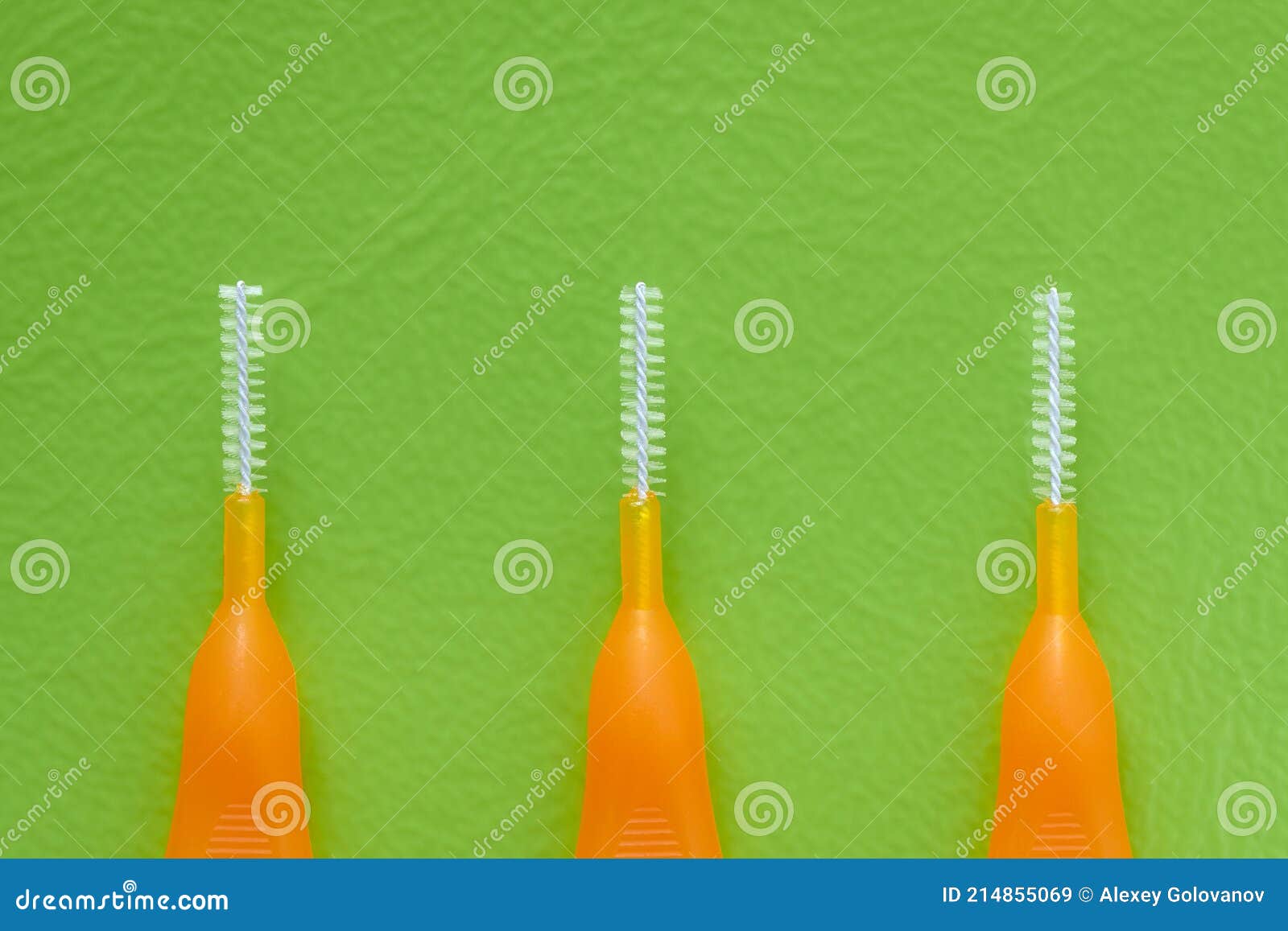 Interdental Brush for Interdental Spaces on Green Background Stock