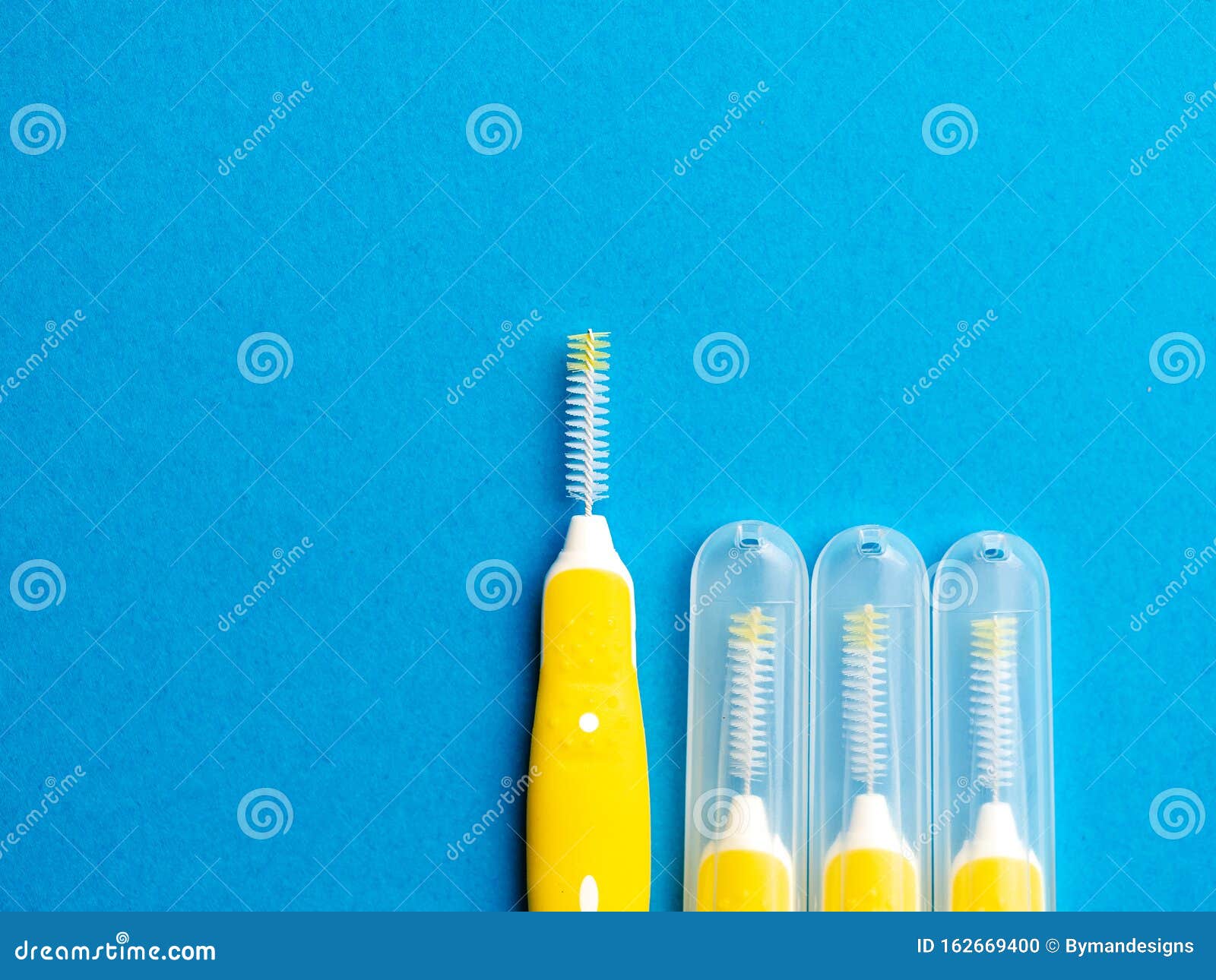 Interdental Brush for Interdental Spaces Over Blue Background with Copy ...