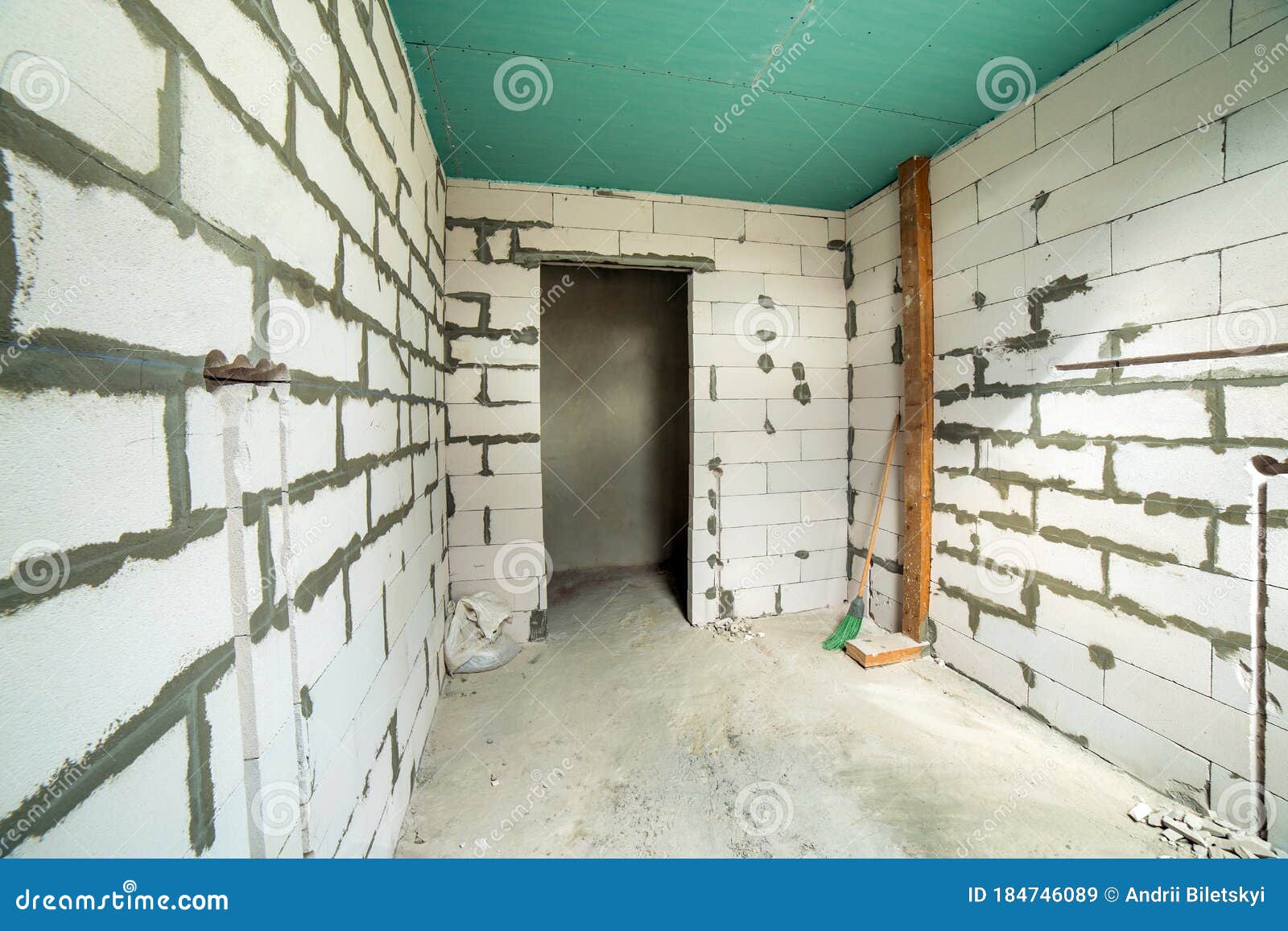 Interior of an Apartment Room with Bare Walls and Ceiling Under