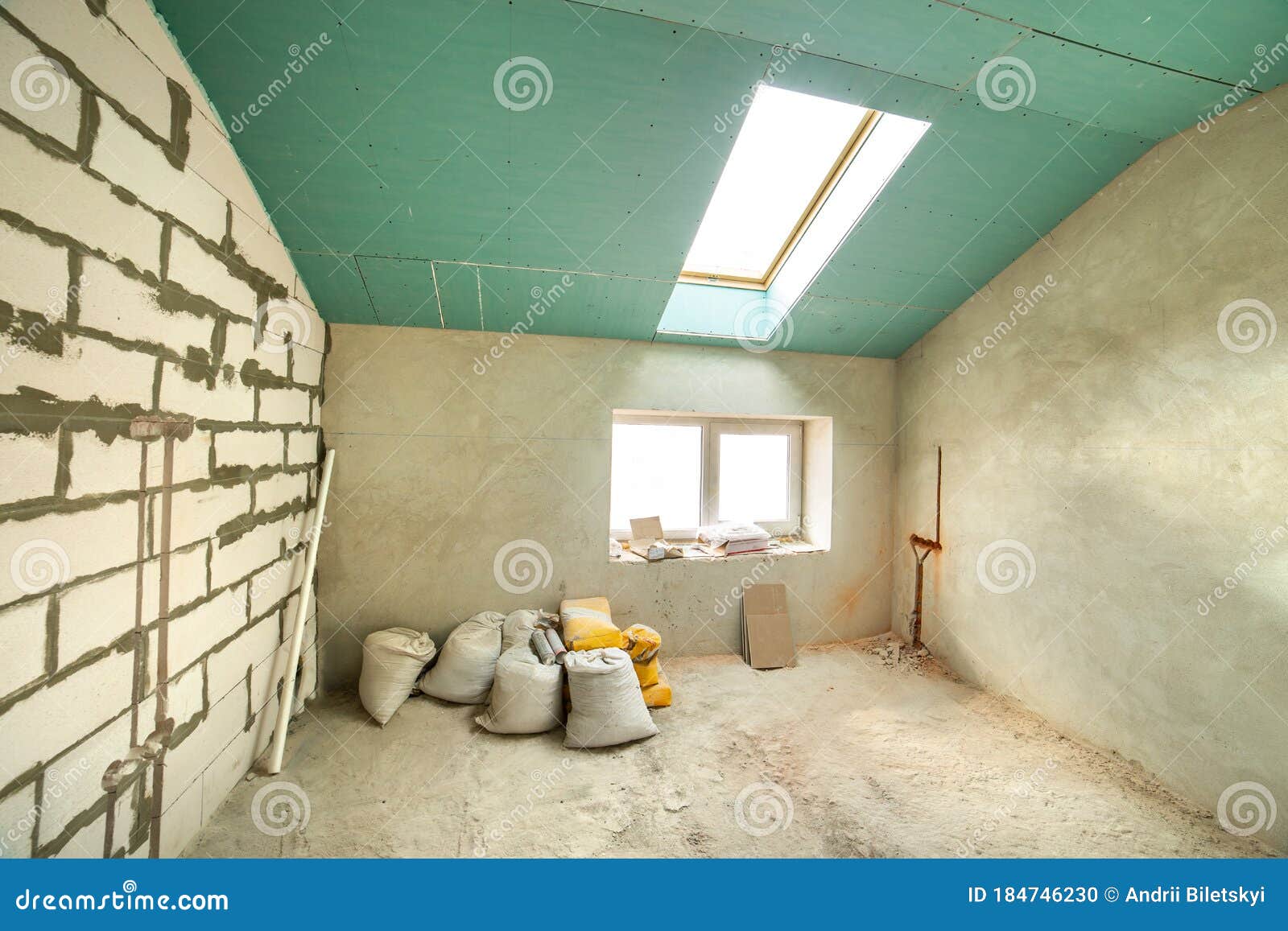 Interior of an Apartment Room with Bare Walls and Ceiling Under