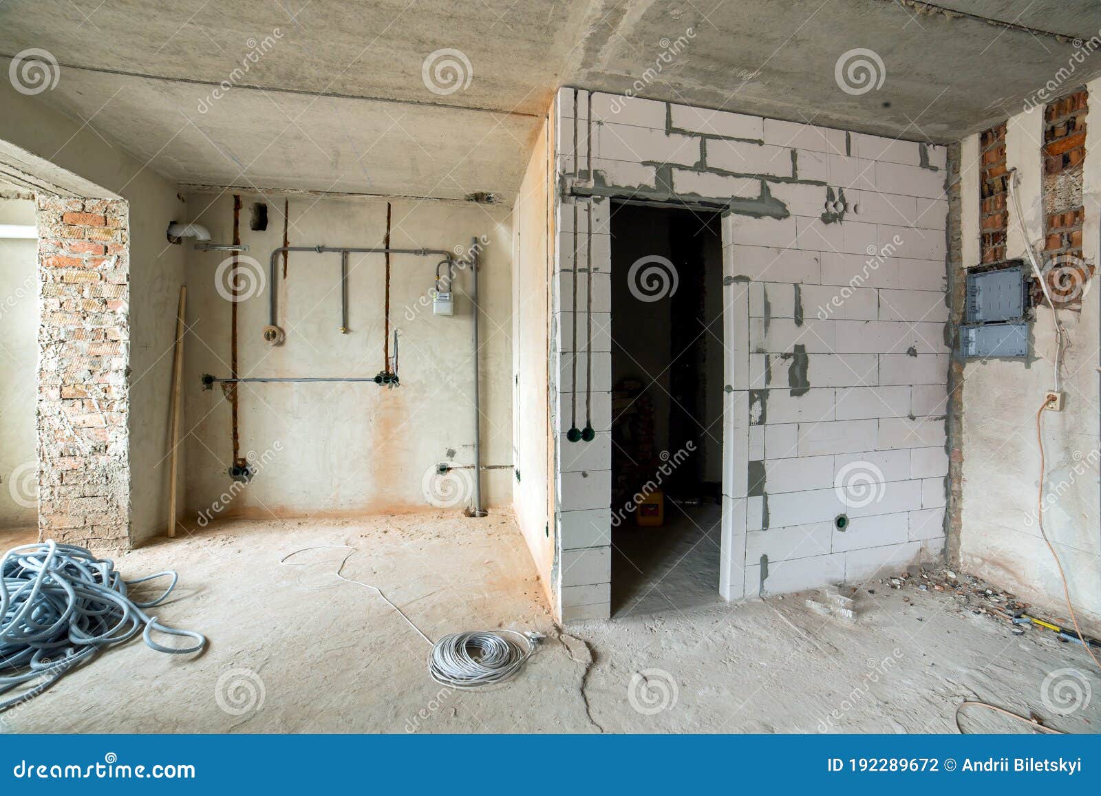 Interior of an Apartment Room with Bare Walls and Ceiling Under