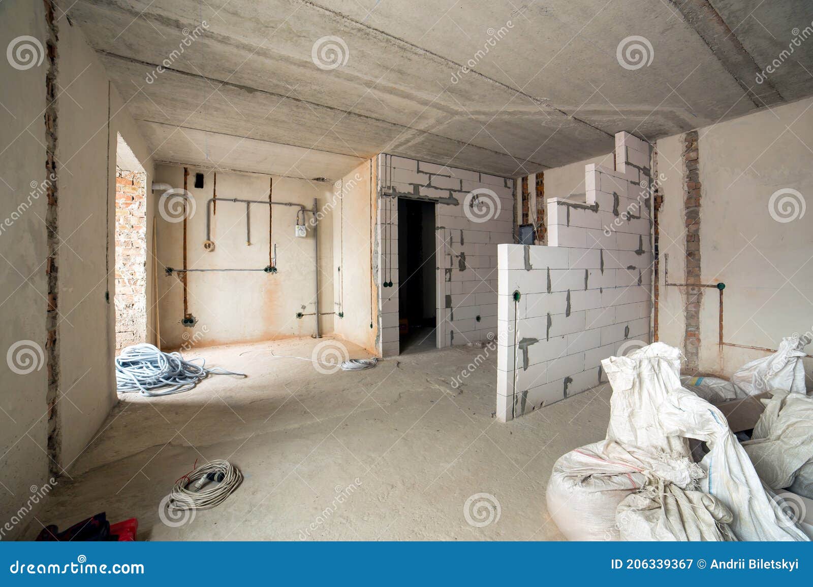 Interior of an Apartment Room with Bare Walls and Ceiling Under