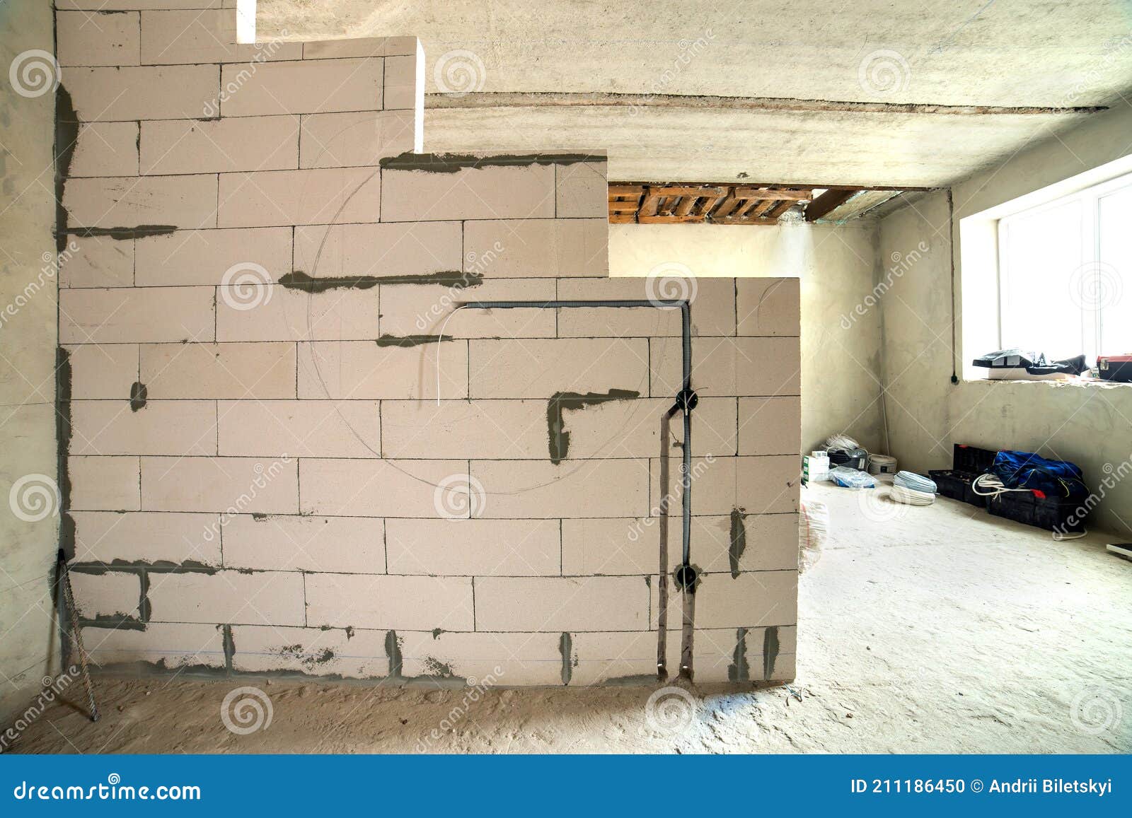 Interior of an Apartment Room with Bare Walls and Ceiling Under