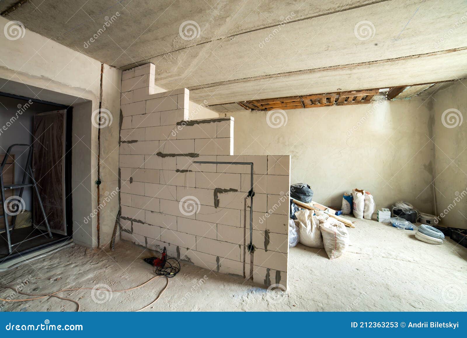 Interior of an Apartment Room with Bare Walls and Ceiling Under