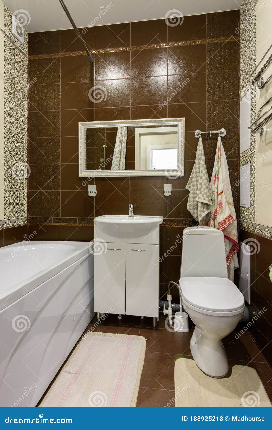 the interior of the bathroom is made in a classic style