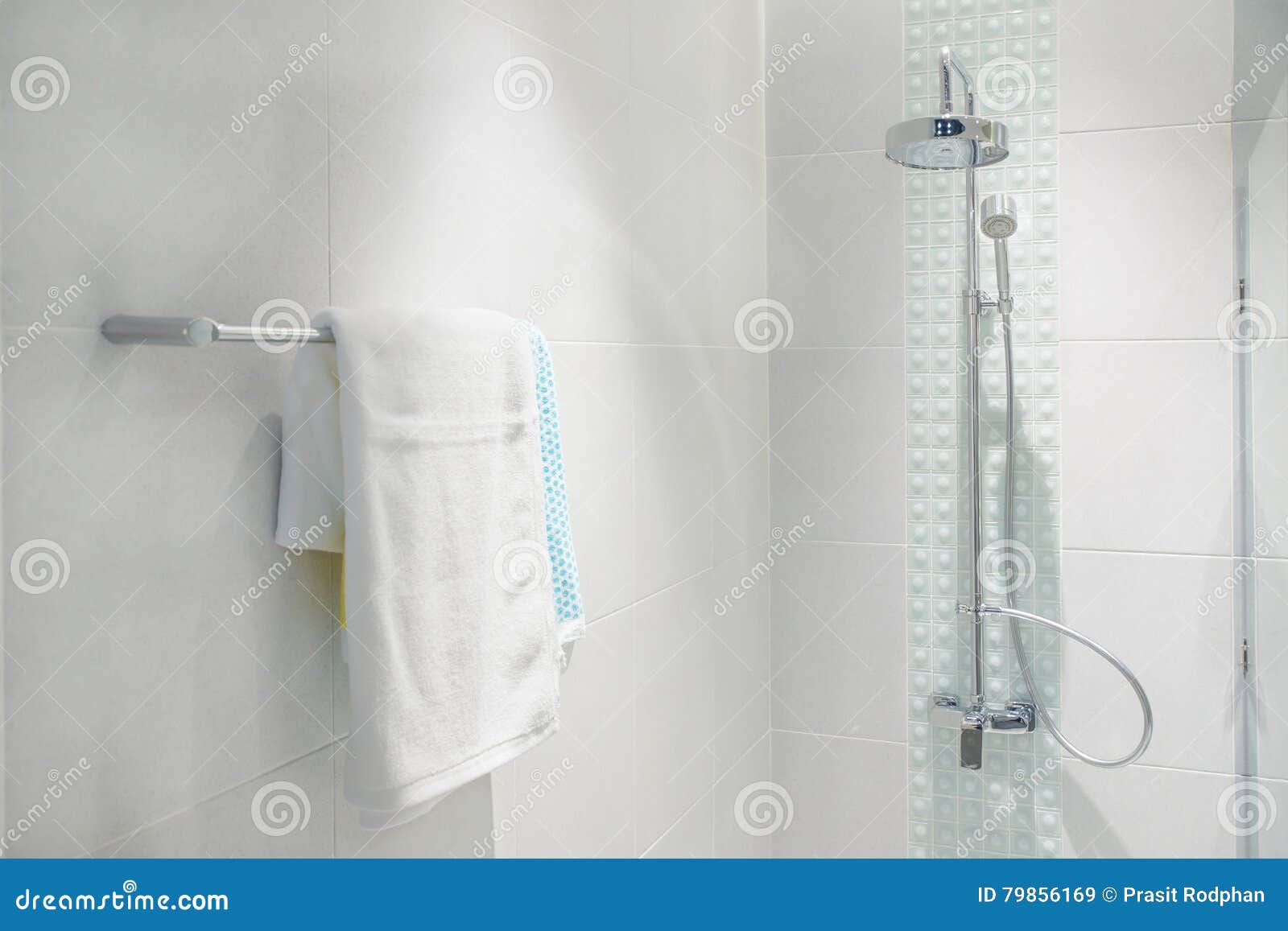 Interior of Bathroom with Modern Shower Head and White Towel Stock