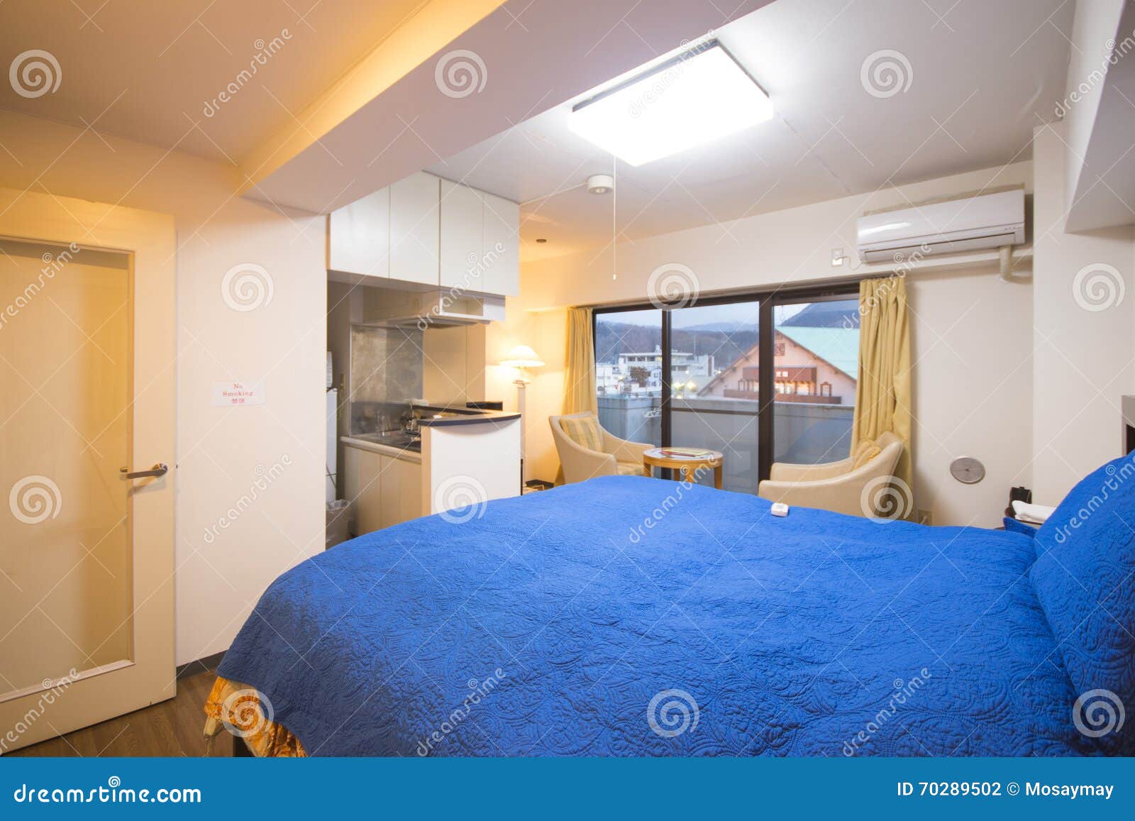 Interior of Bedroom with Blue Bed Linen Stock Photo Image of house, light 70289502
