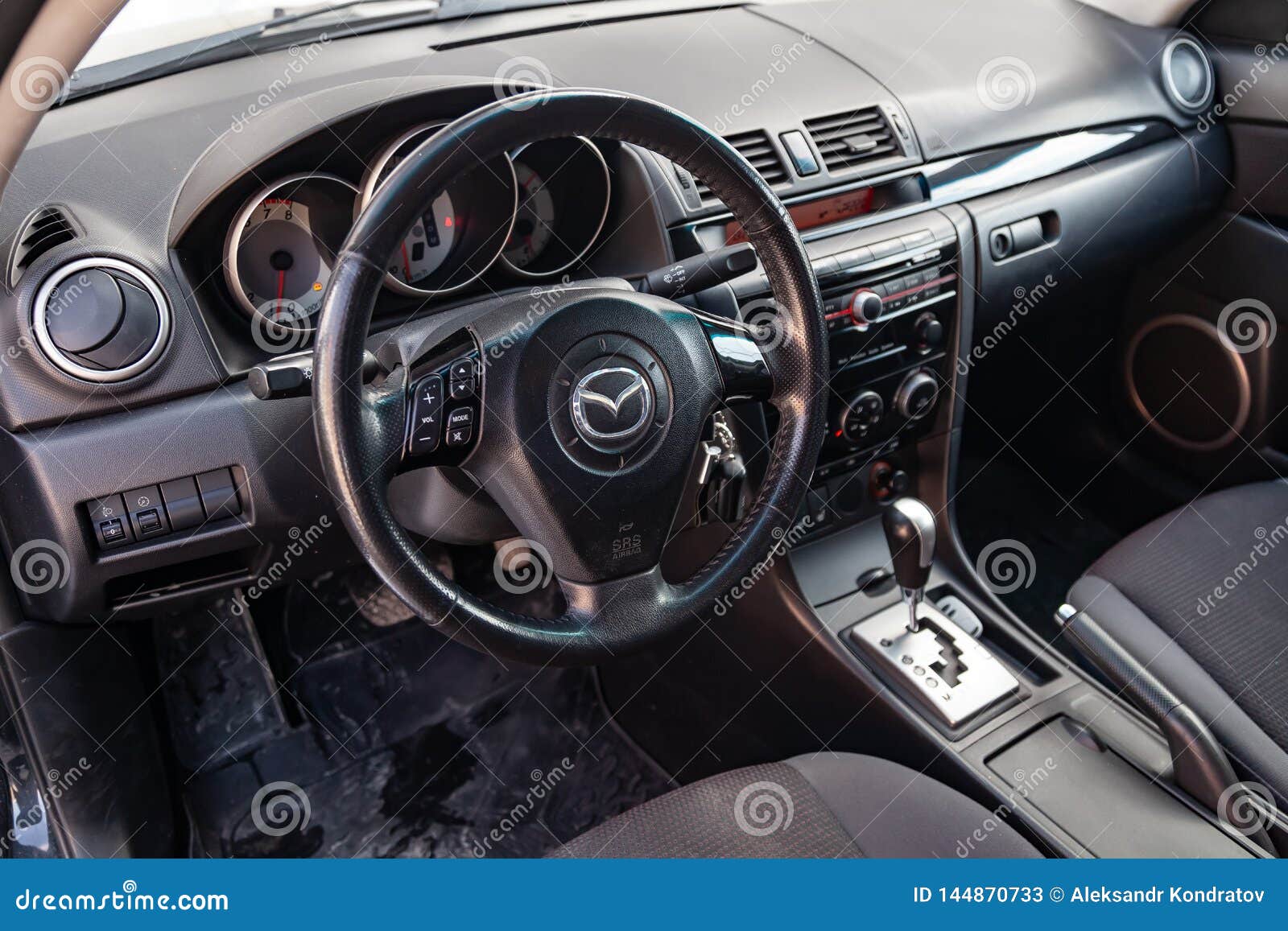 The Interior Of The Car Mazda 3 With A View Of The Steering