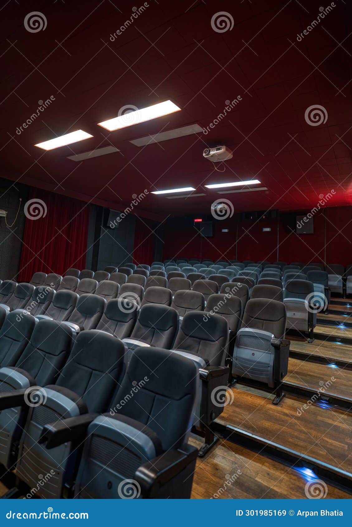 Interior of a Cinema Hall with Projector Handing on the Ceiling, Empty