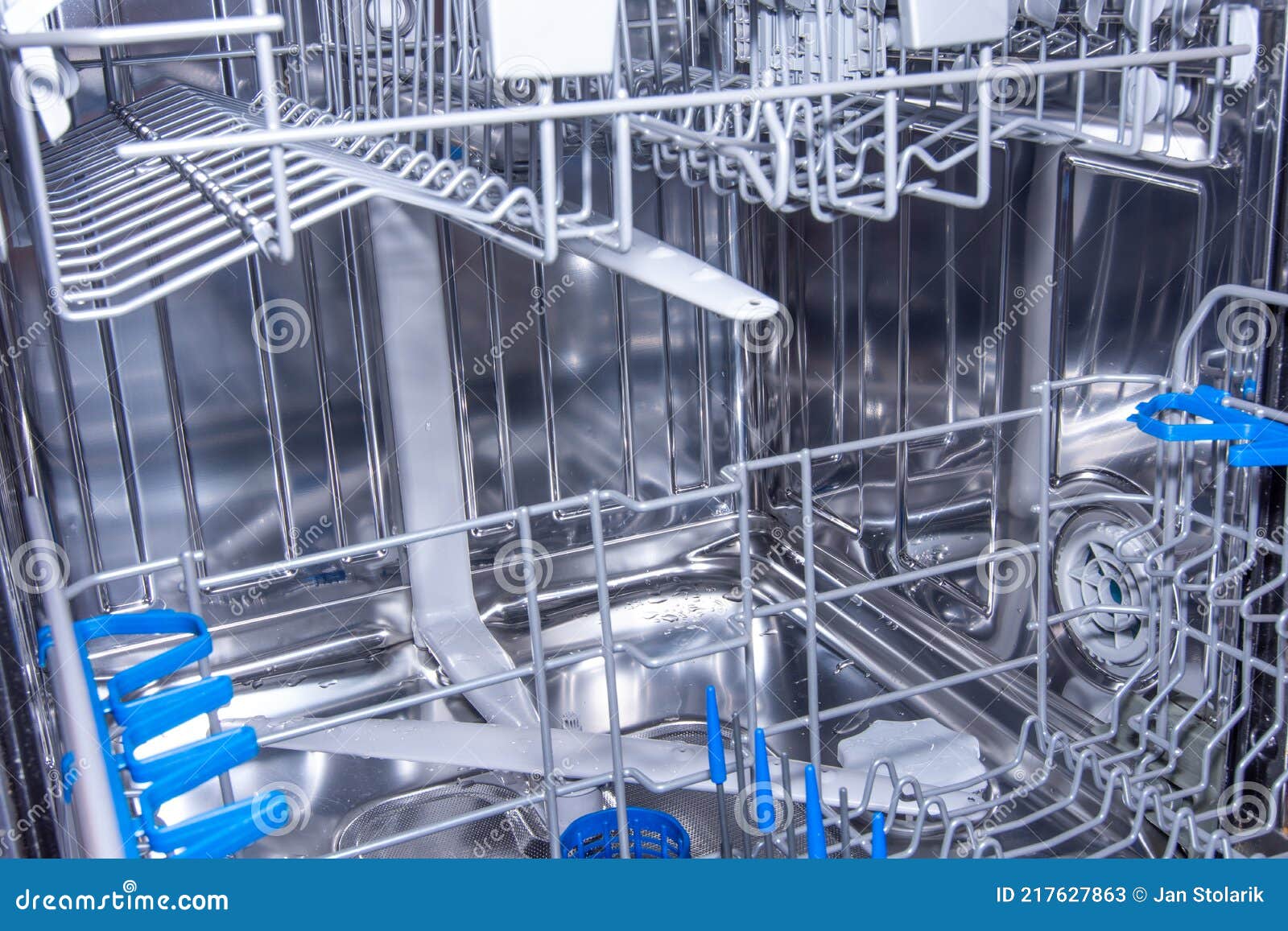 Interior of Clean Modern Stainless Steel Dishwasher after Washing