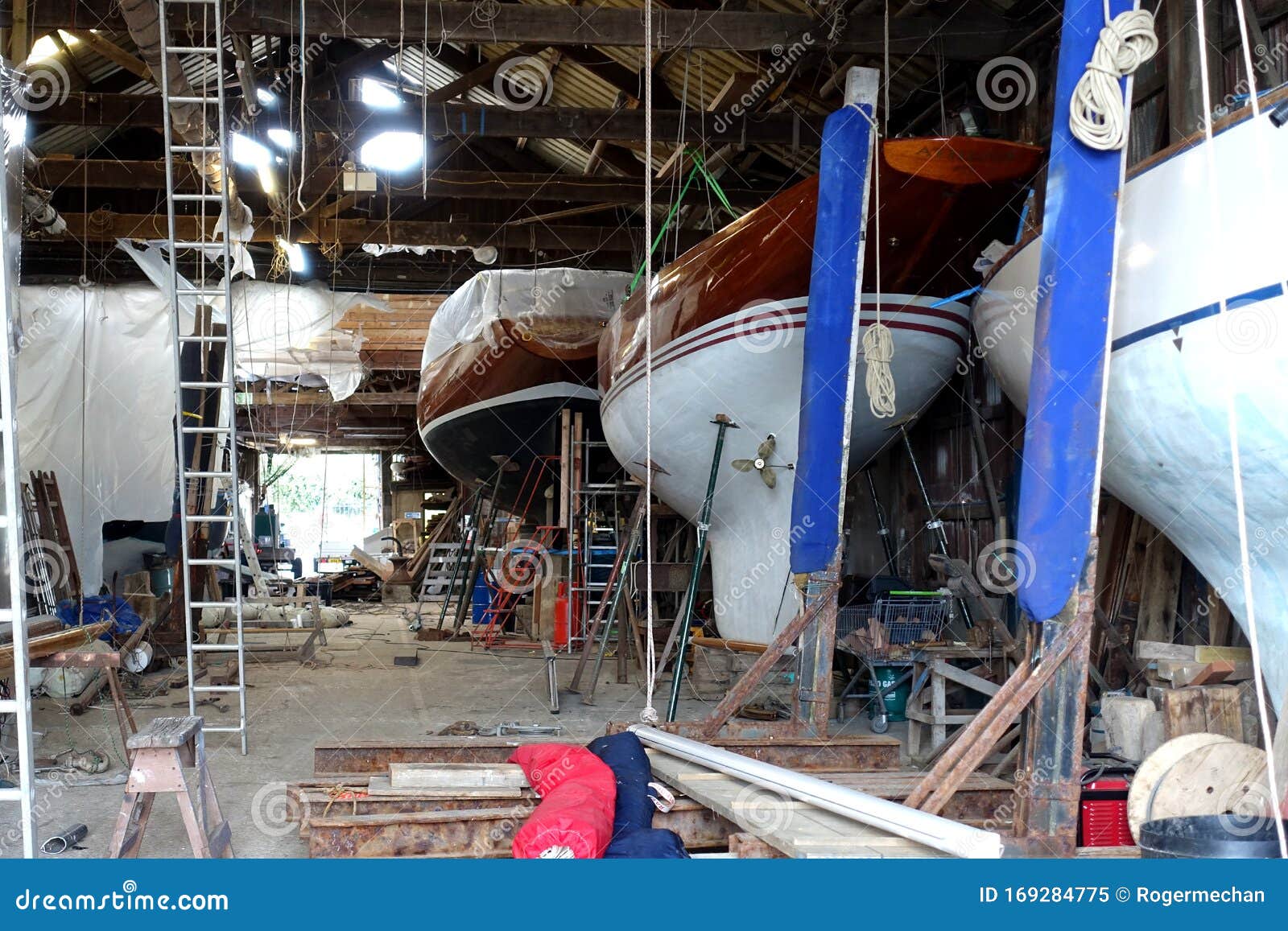The Interior of a Boat Repair Yard, England. Boats Under Repair and ... - Interior Commercial Boat Repair YarD Showing Boats Supports Being RepaireD Slipways Cranes Miscellaneous Equipment 169284775