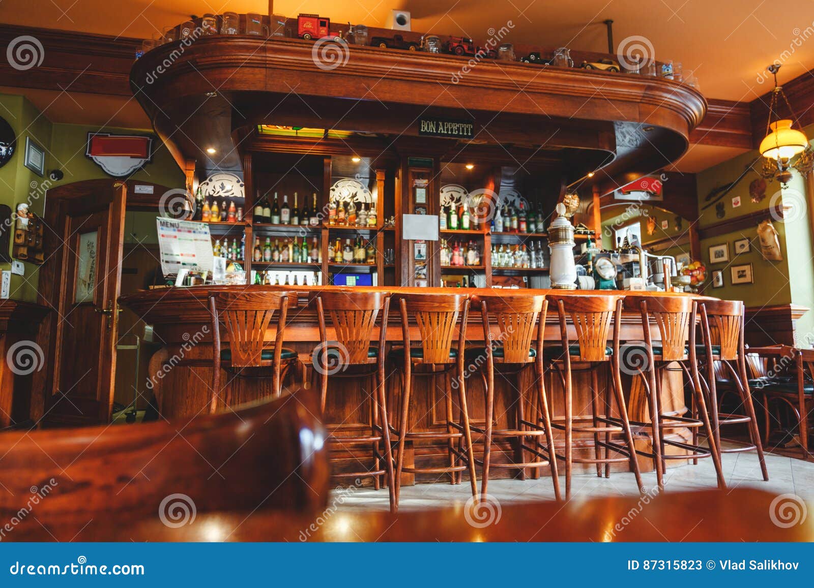 interior of costly stylish bar, made of mahogany in the irish pub.