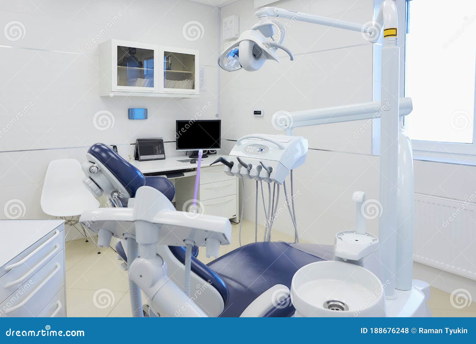 an interior of a dental office with white and blue furniture. dentistÃ¢â¬â¢s office